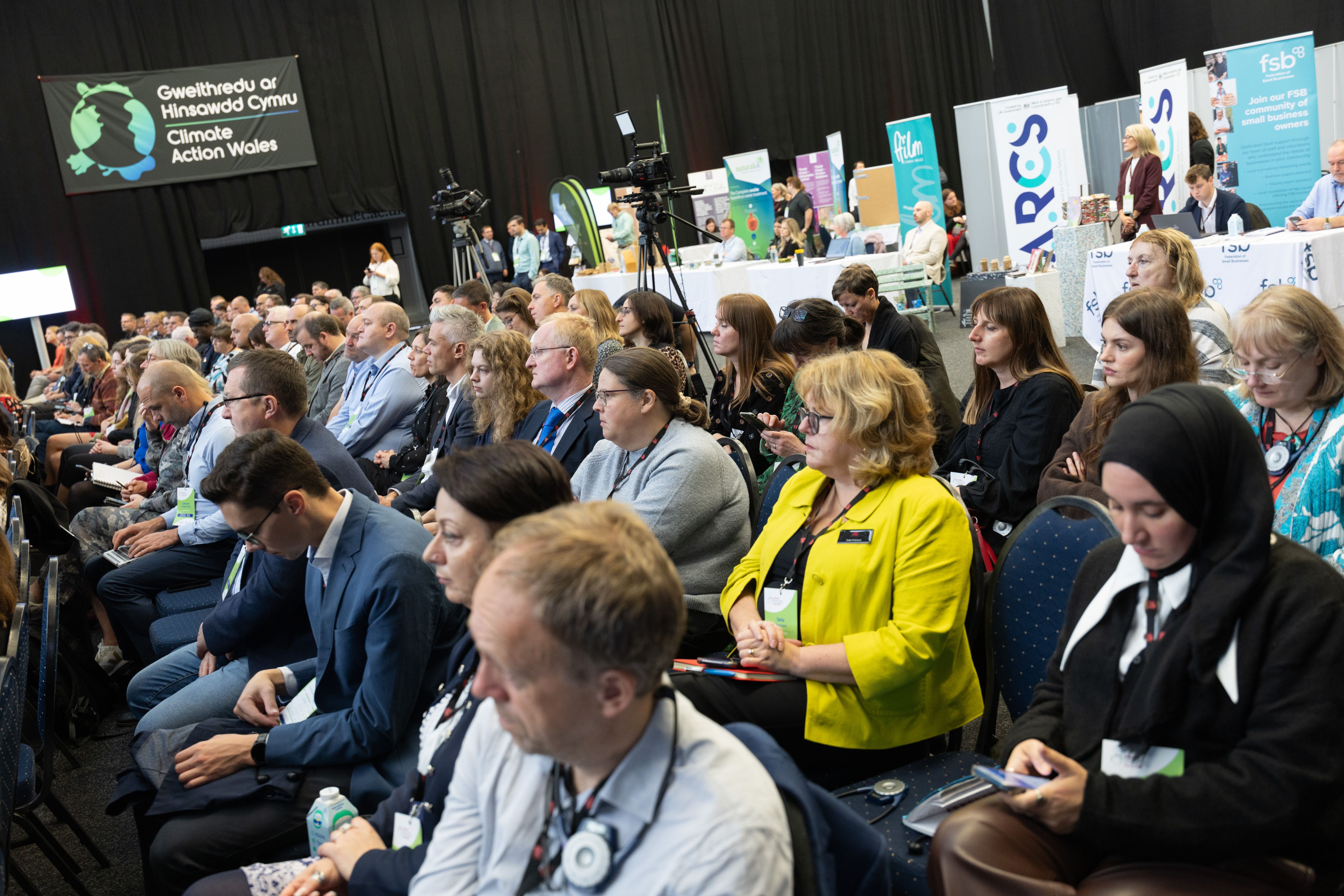 Delegates listen to the proceedings.