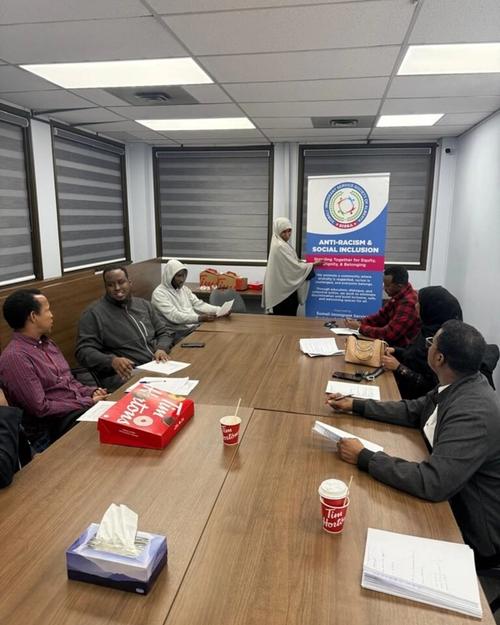 A facilitator speaking to attendees at a SISSA Anti-Racism Community Session, April 2026.