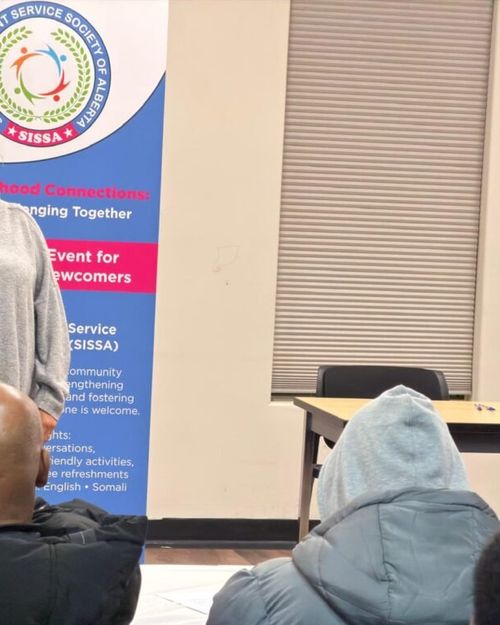 A speaker addressing neighbours at SISSA's Neighbourhood Connections event.
