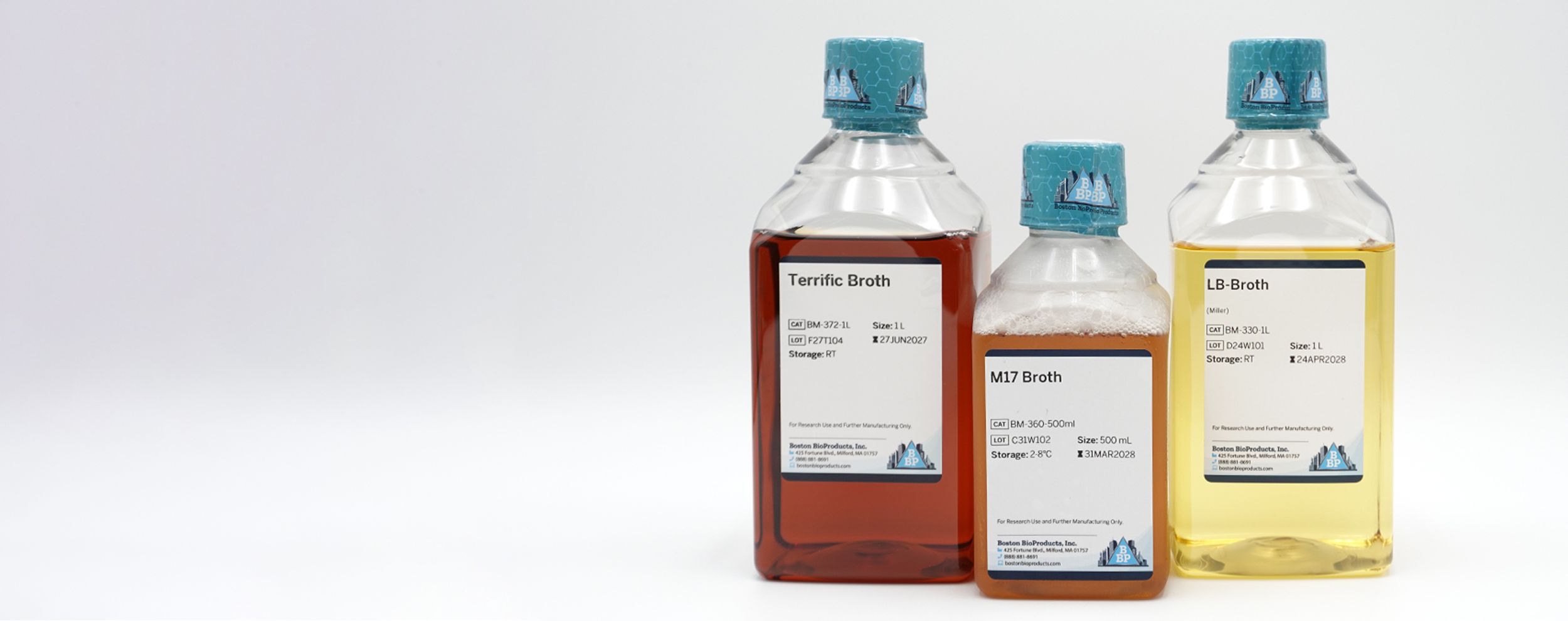 Yeast and bacteria culture media bottles arranged in a microbiology research lab