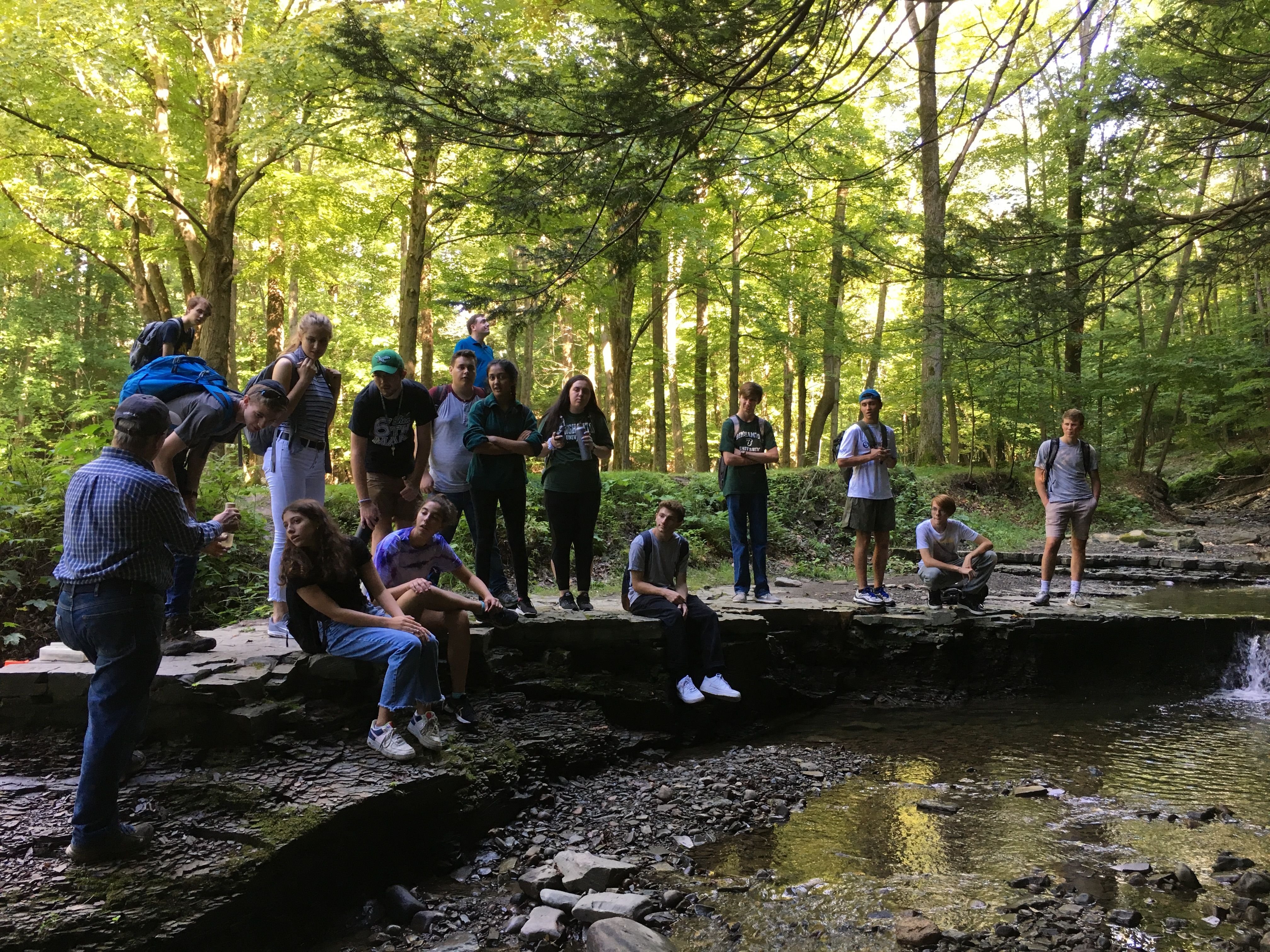 Students walk the campus watershed up Fuller Hollow Creek
