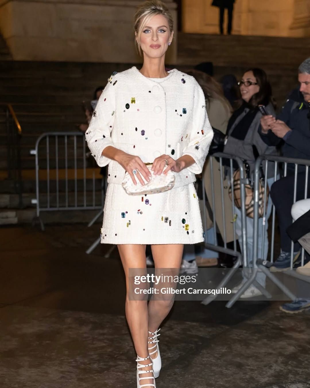 Nicky Hilton wearing the Louis Vuitton 2006 White Satin Multicolor Monogram Aumoniere Evening Bag