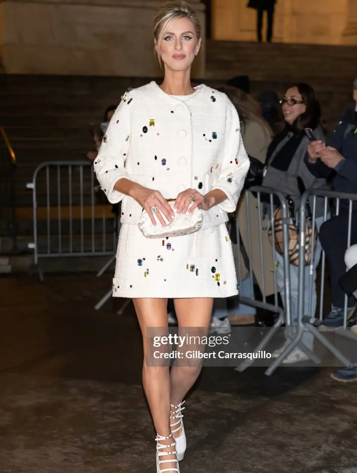 Nicky Hilton wearing the Louis Vuitton 2006 White Satin Multicolor Monogram Aumoniere Evening Bag