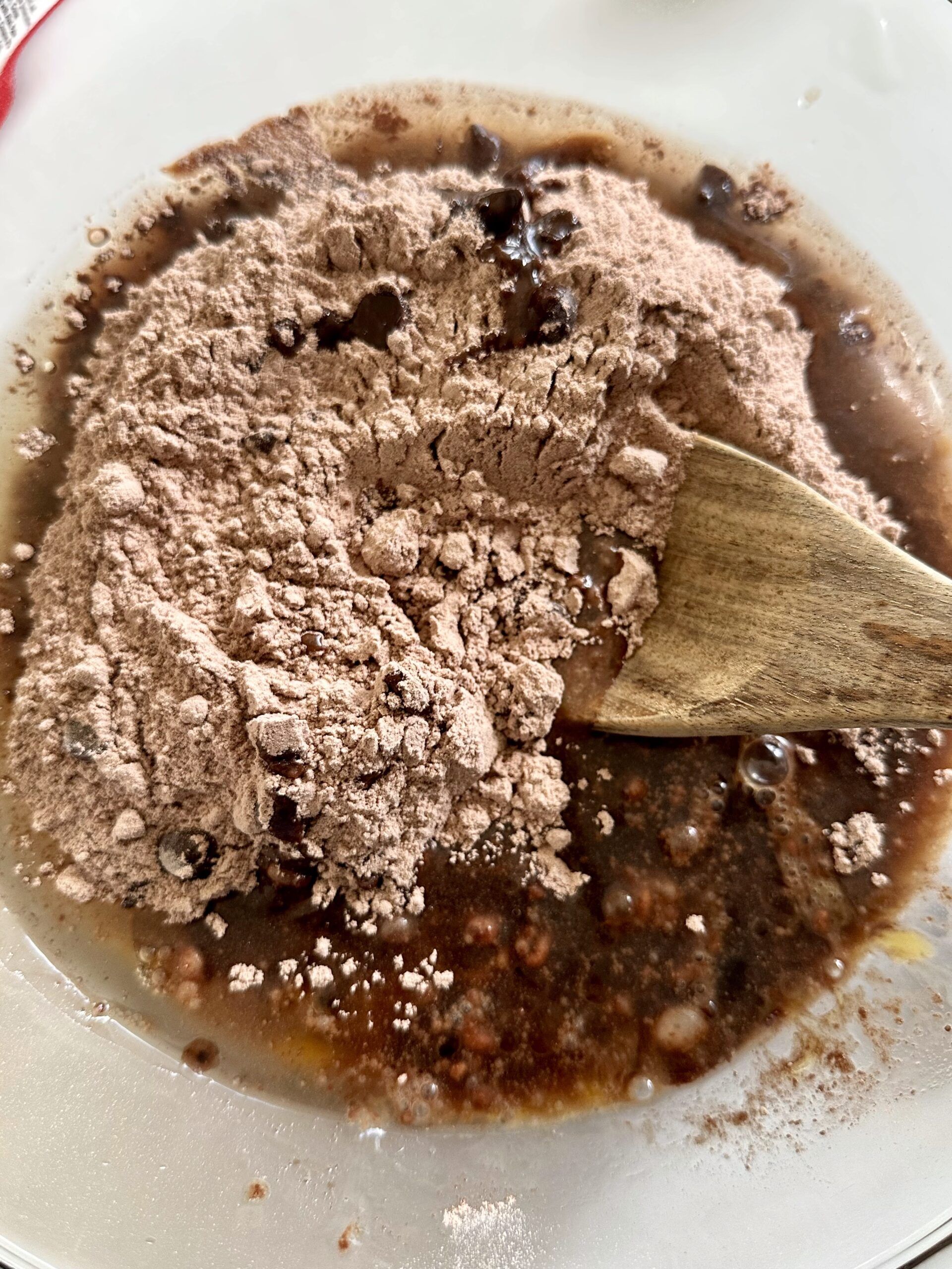 Guinness brownie ingredients being mixed in a bowl