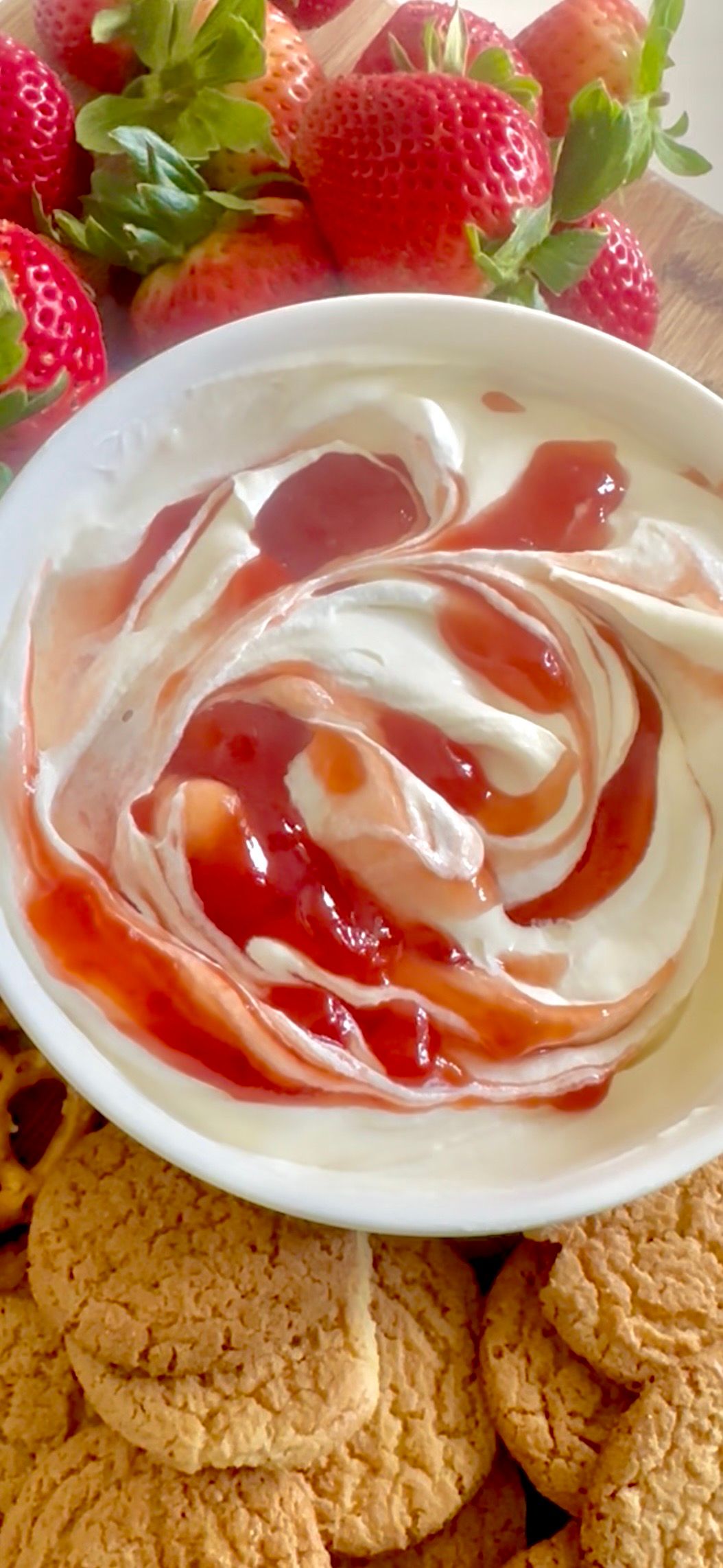 Strawberry cheesecake dip served with cookies and fresh fruit