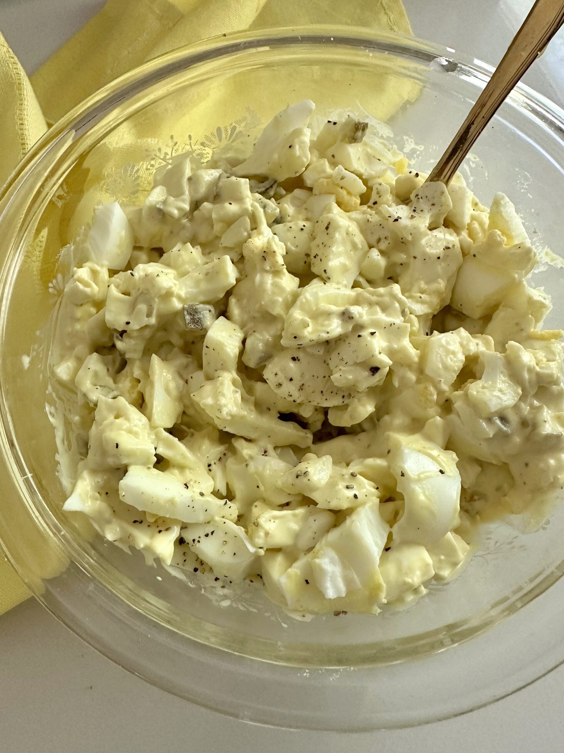 Chopped eggs mixed with mayonnaise, mustard, and sweet salad cubes