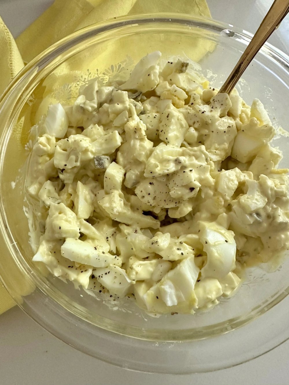 Chopped eggs mixed with mayonnaise, mustard, and sweet salad cubes