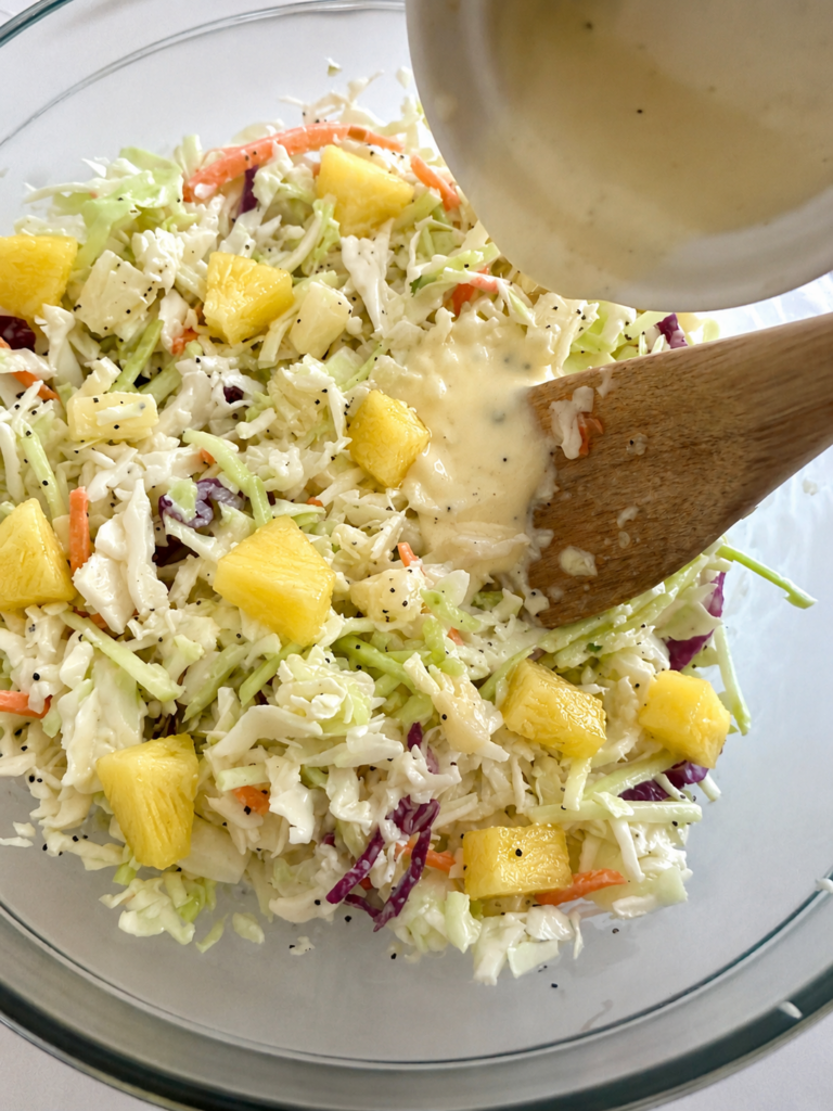 Pineapple coleslaw tossed with creamy dressing