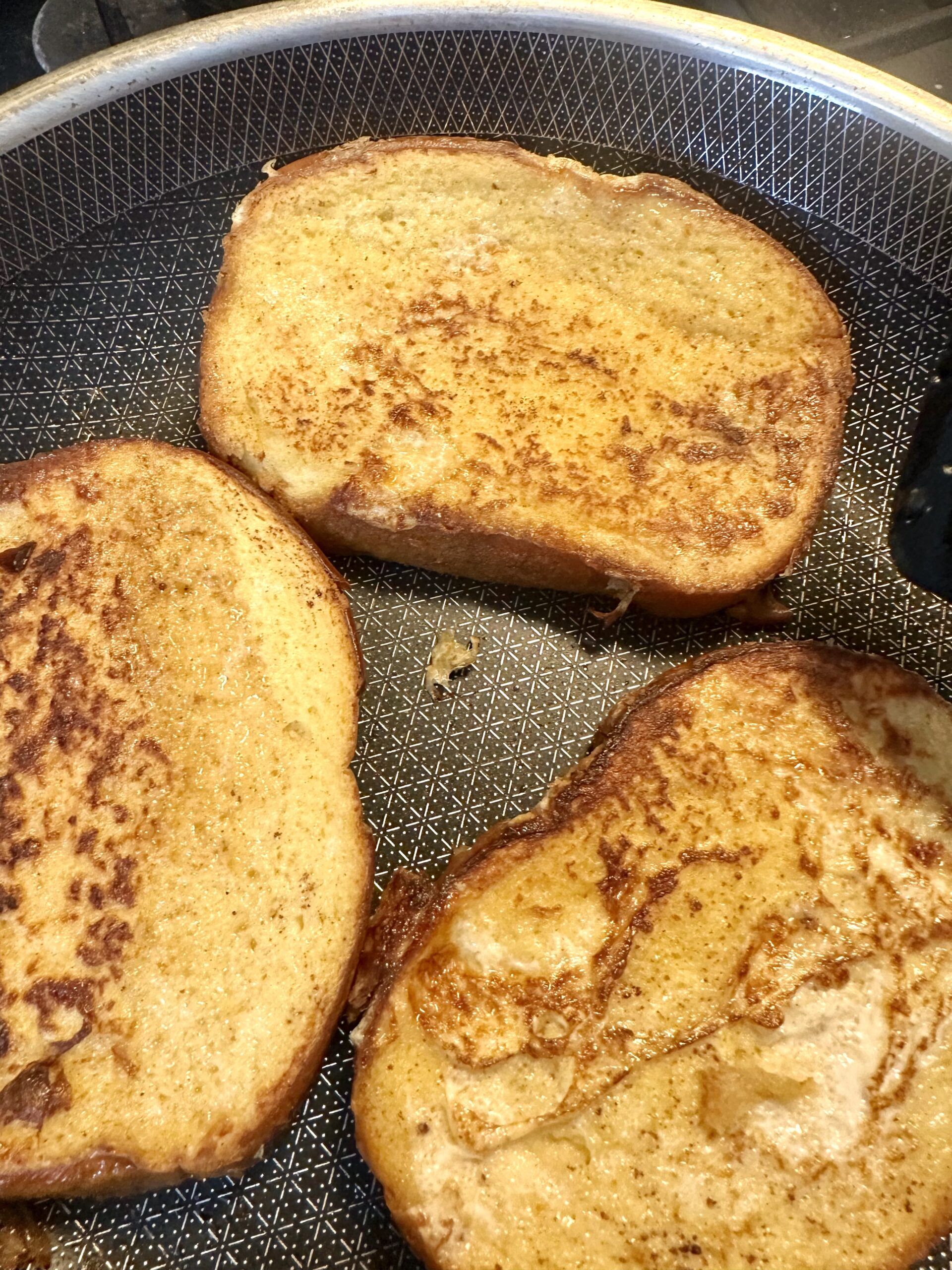 Hot French toast finished with butter before serving