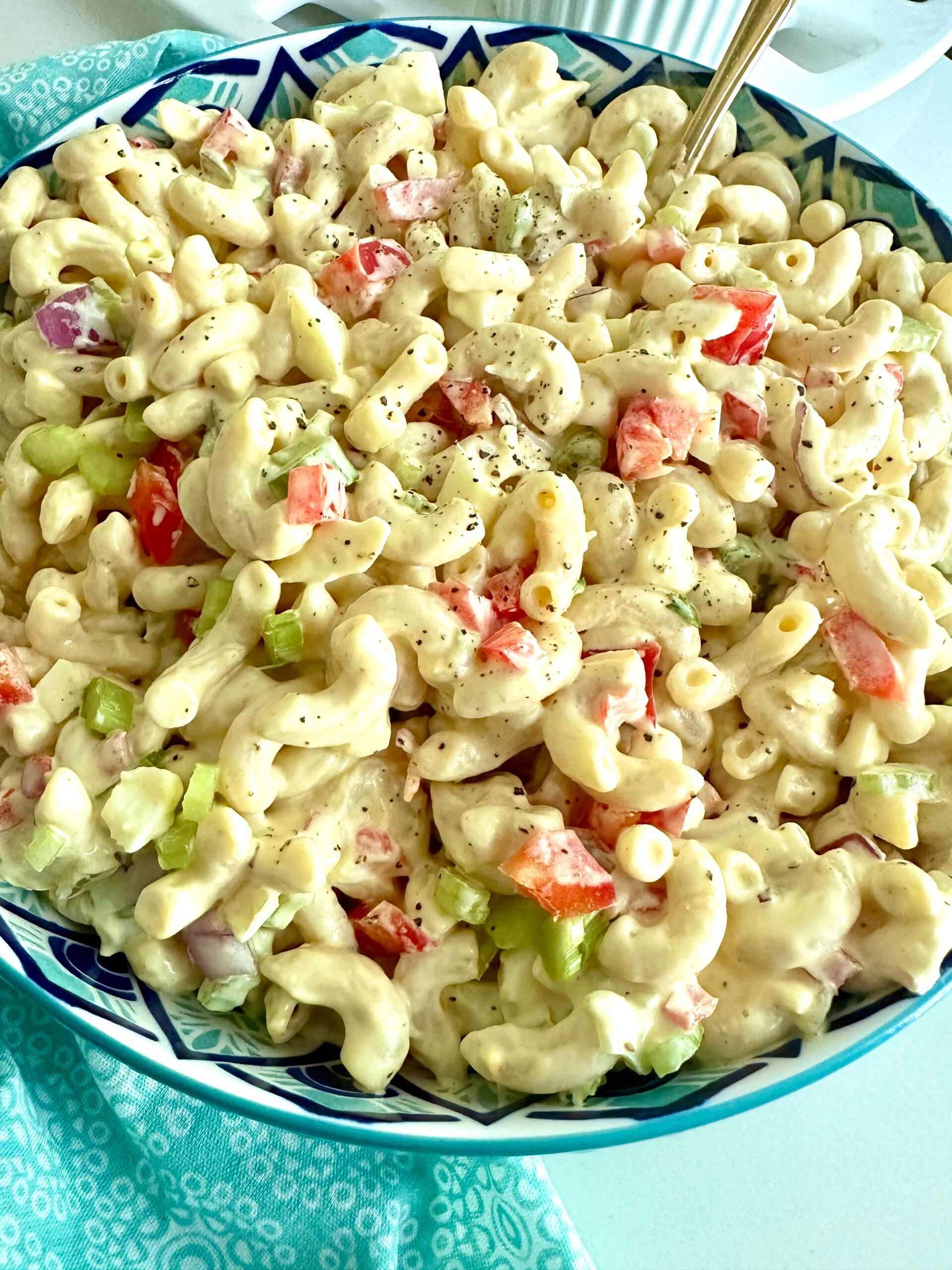A full bowl of creamy classic macaroni salad