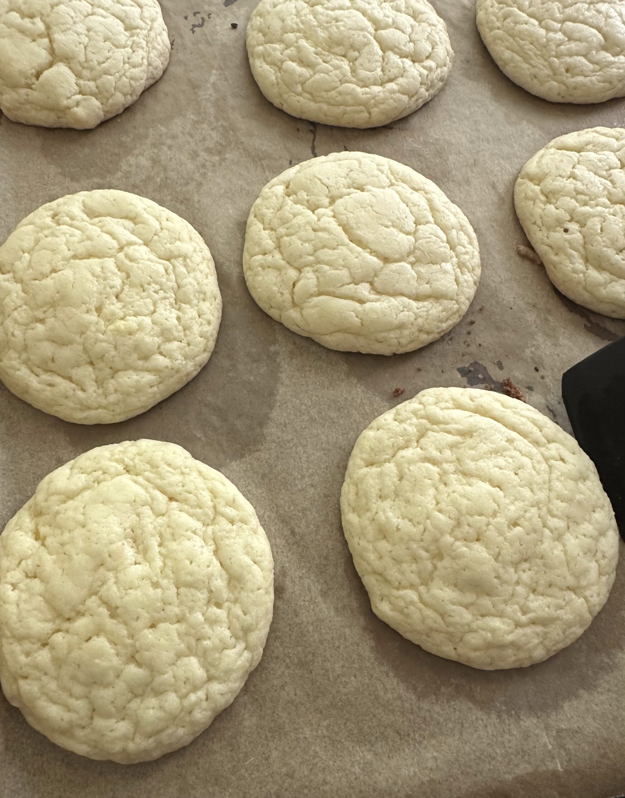 Freshly baked cake mix cookies cooling before glazing