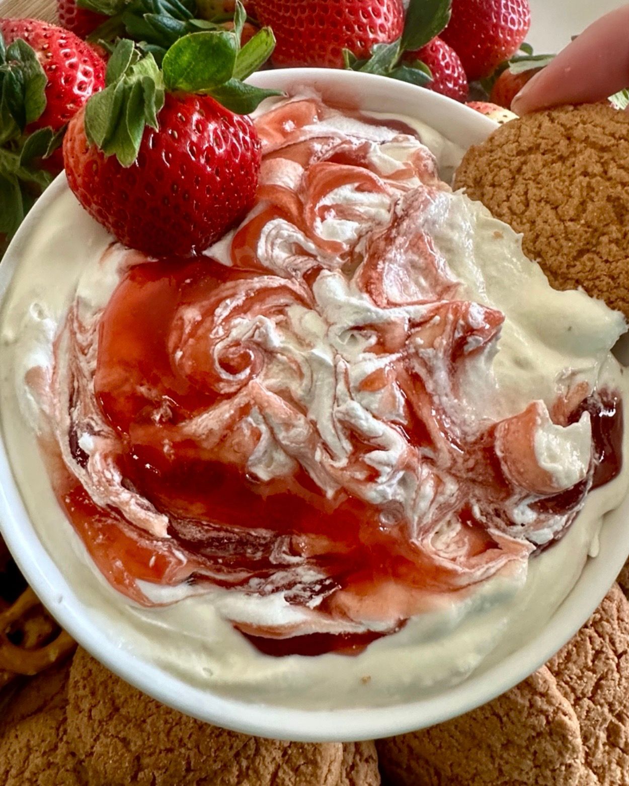 Strawberry cheesecake dip in a shallow serving bowl