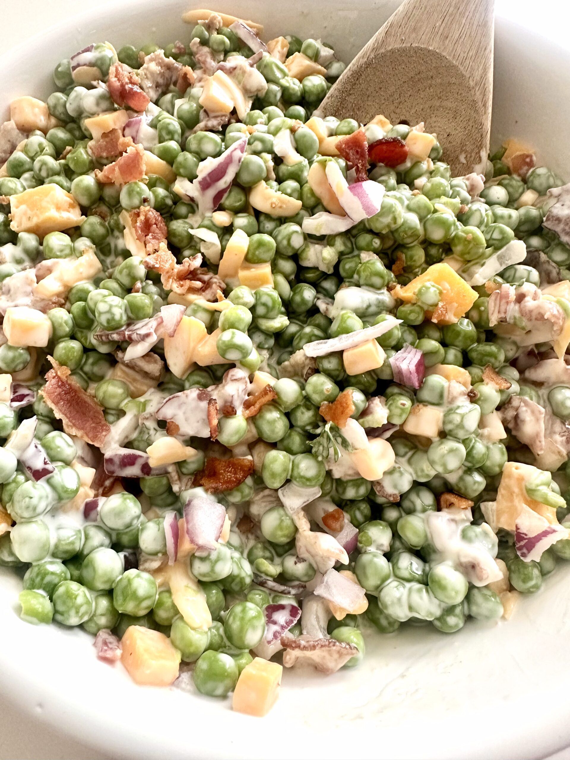 Ingredients for Southern pea salad with peas, bacon, cheddar, and dressing