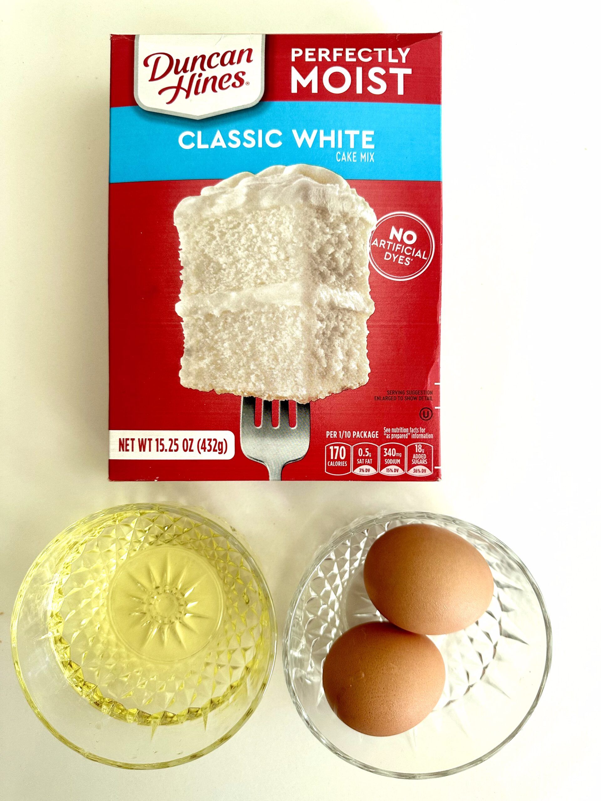 Ingredients measured for white cake mix cookies and vanilla glaze