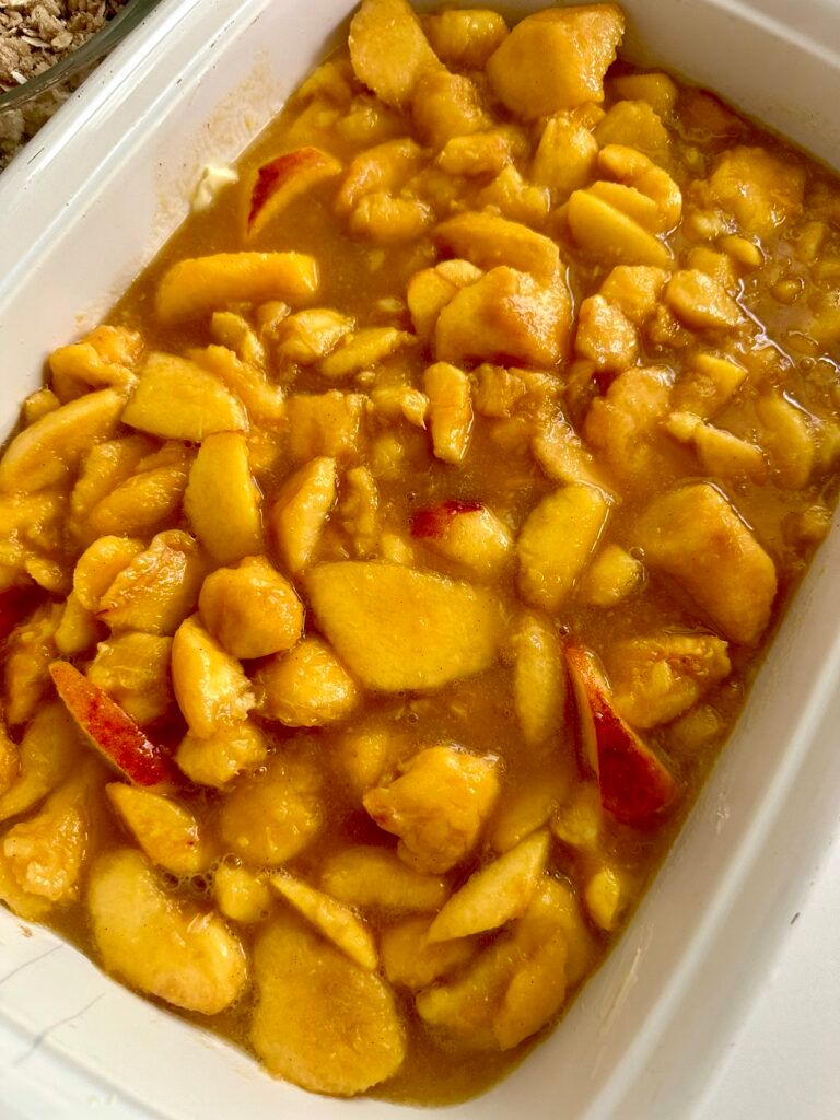 Peach filling spread in a baking dish