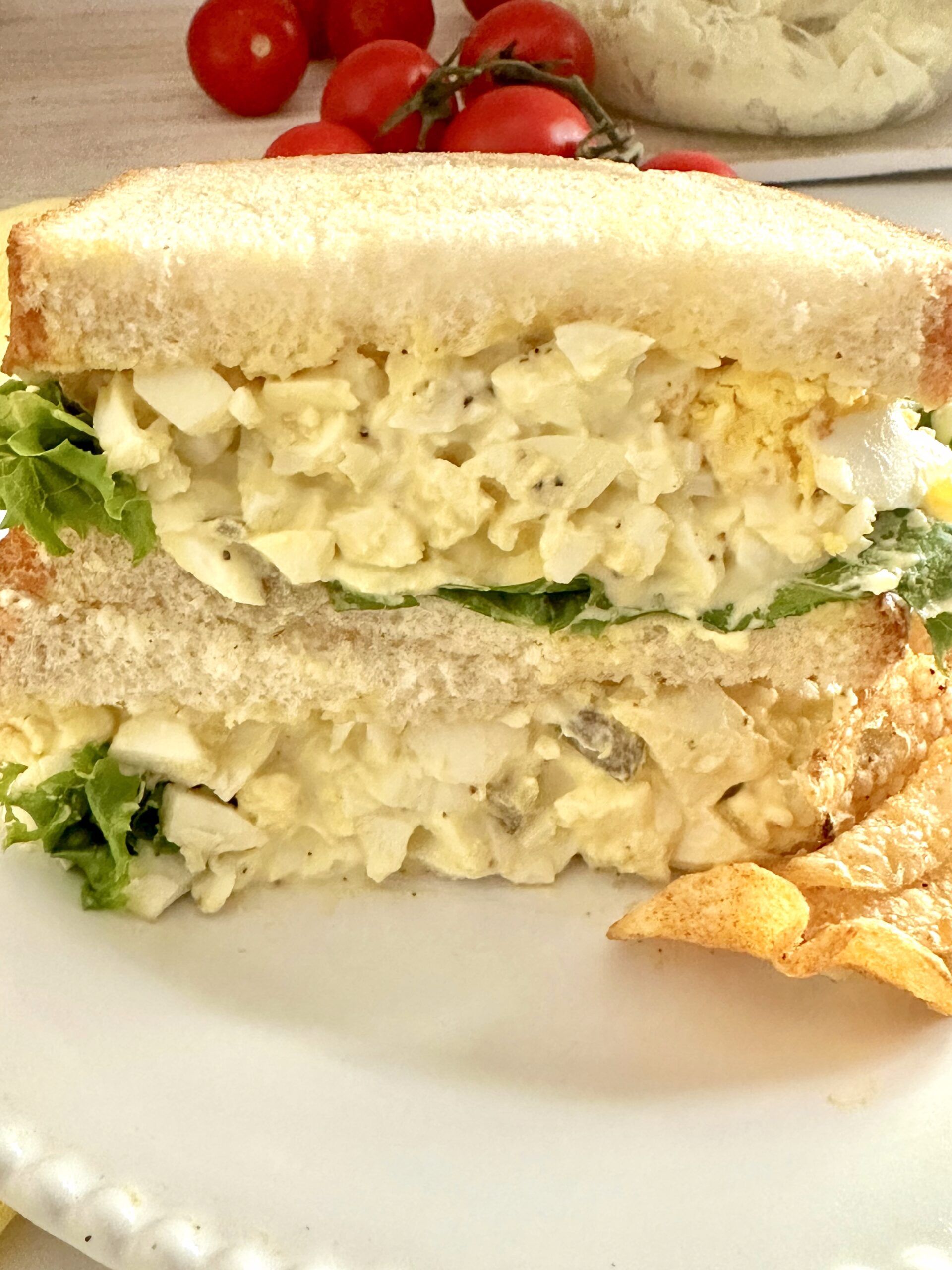 Southern egg salad spooned onto soft white sandwich bread