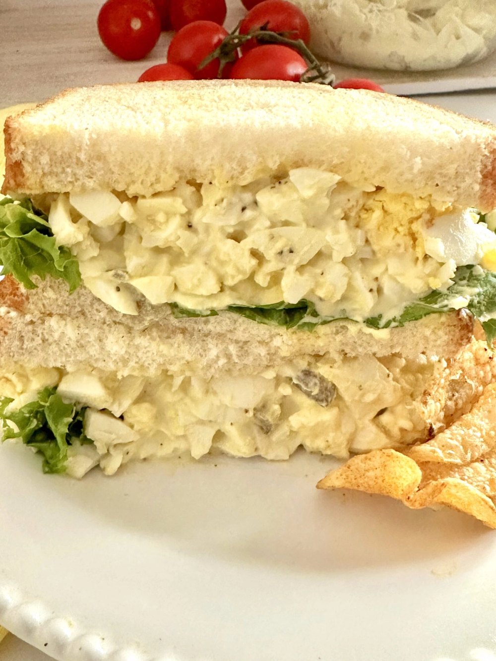 Southern egg salad spooned onto soft white sandwich bread