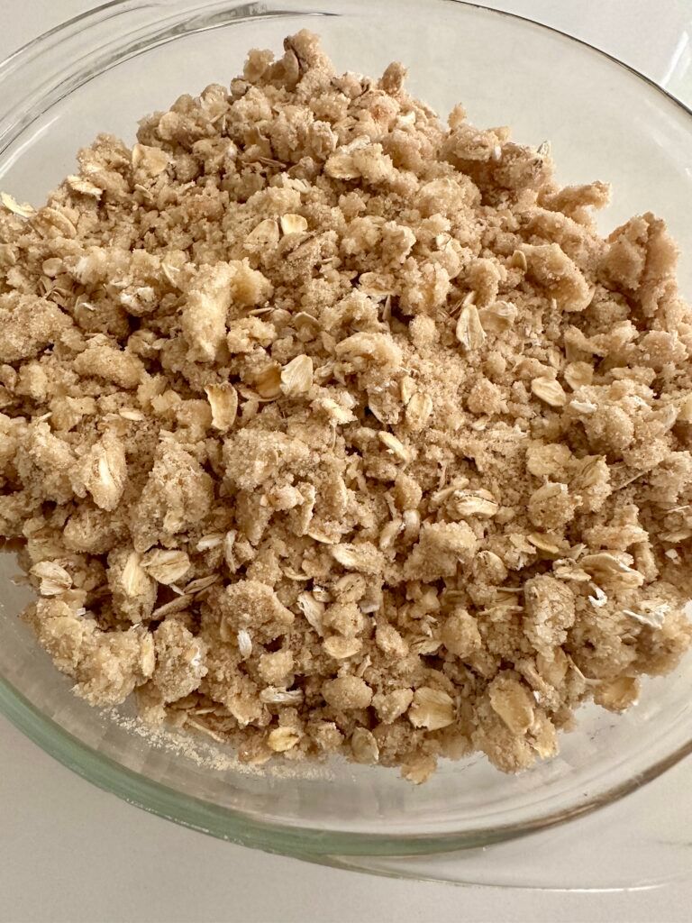 Buttery oatmeal crumble topping prepared for peach crisp
