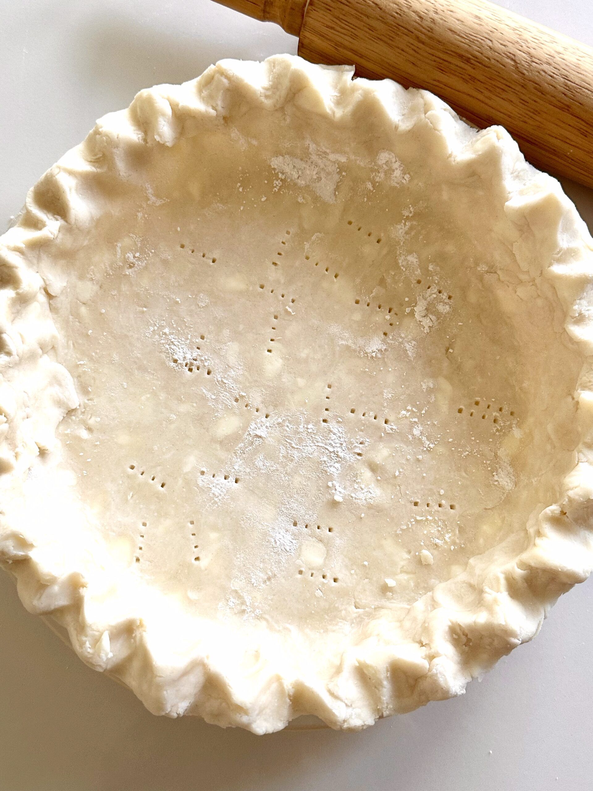 Homemade flaky pie crust shaped in a pie plate