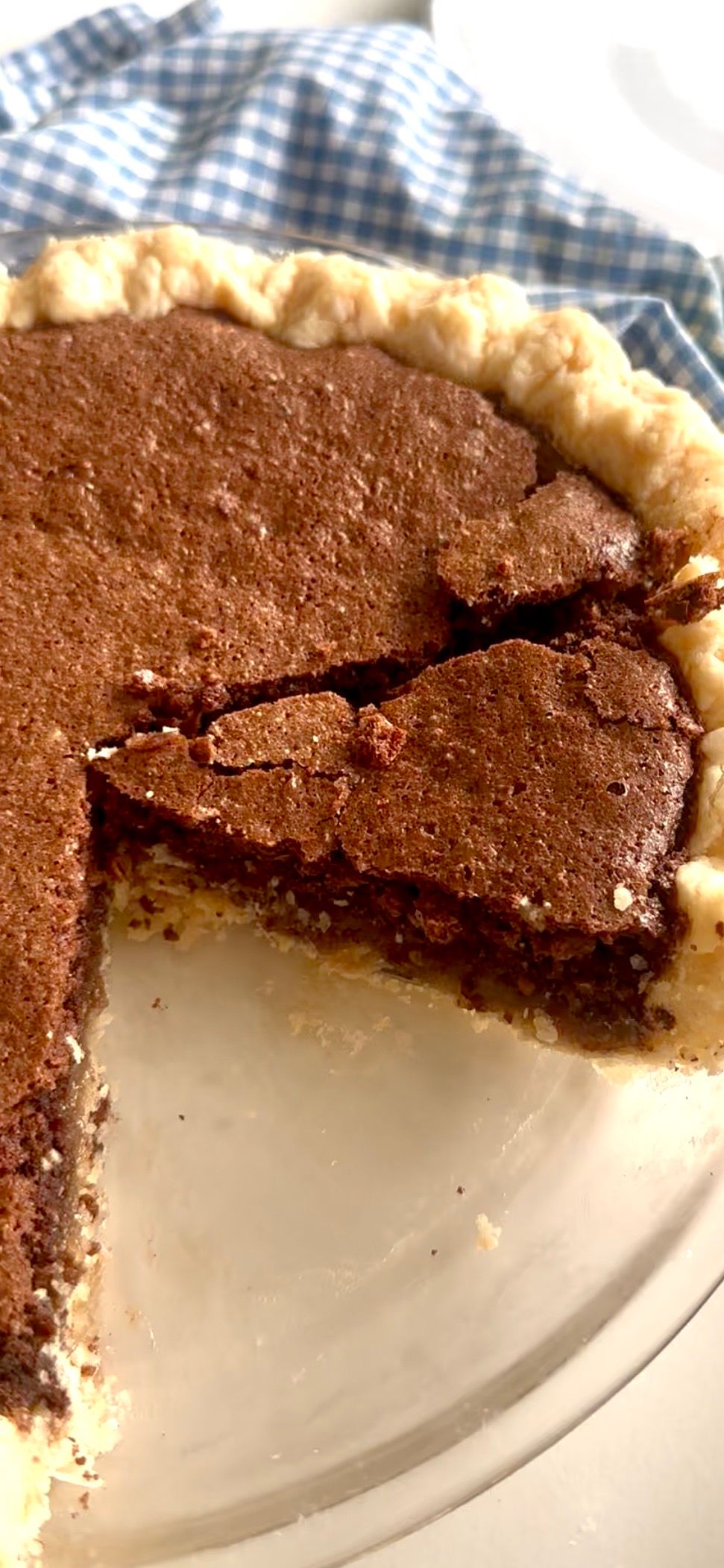 Slice of old fashioned chocolate fudge pie showing its gooey center