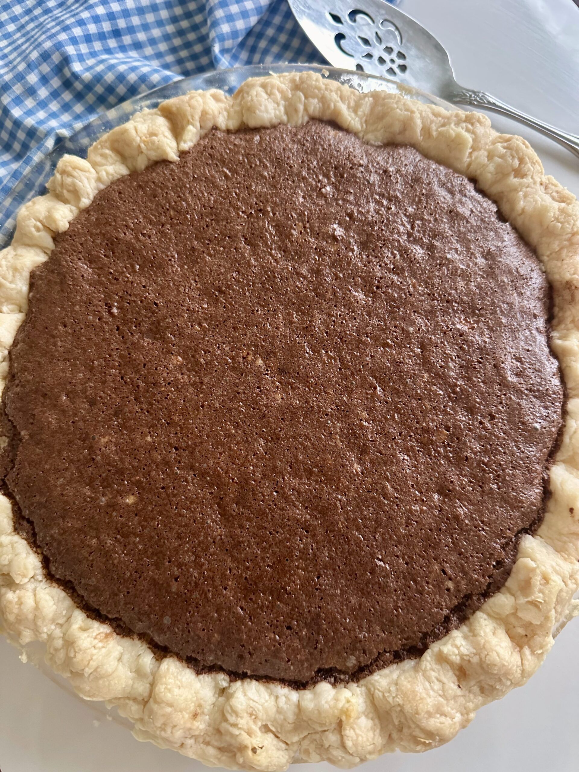 Chocolate fudge pie freshly baked in its pastry crust