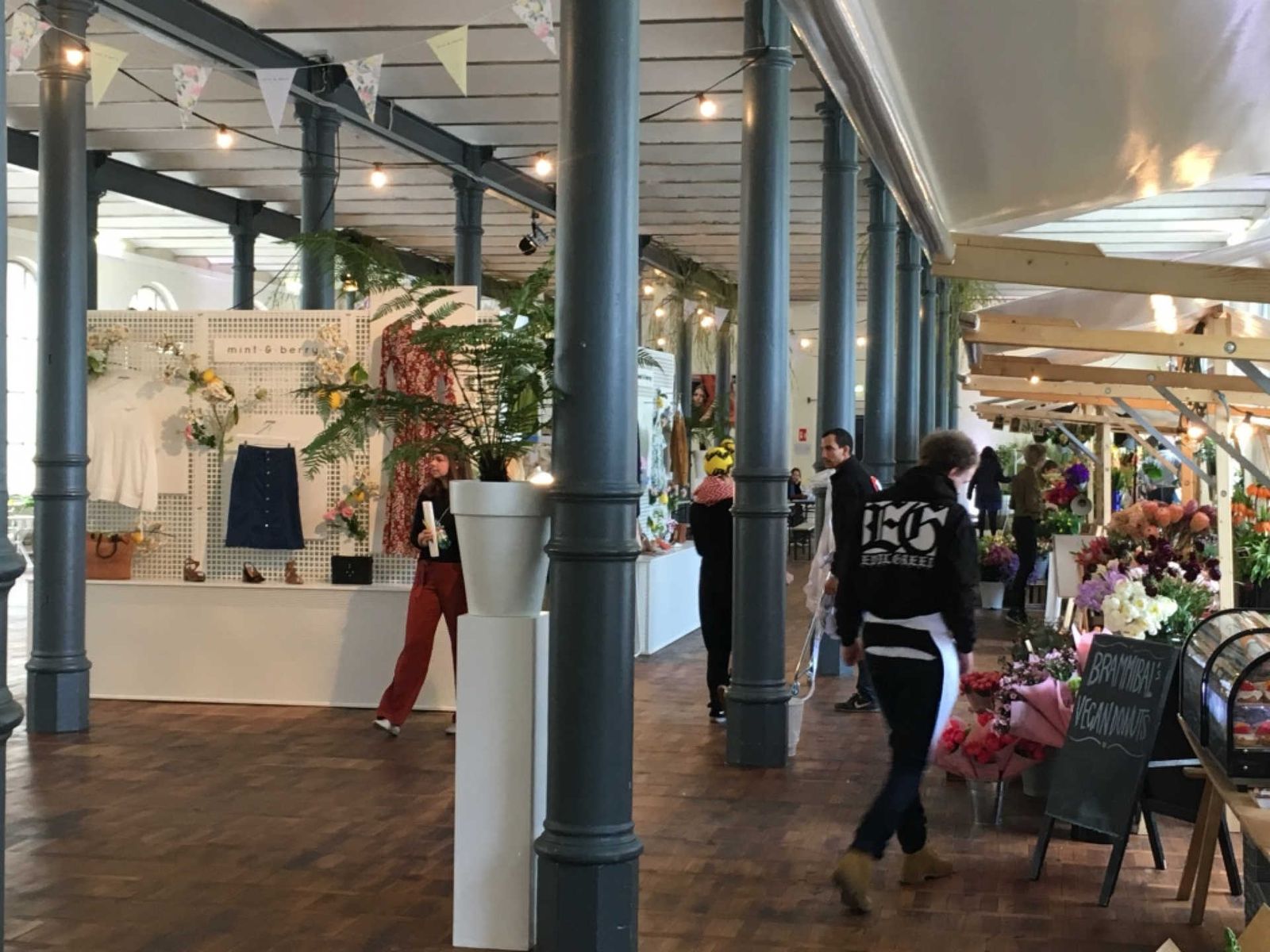 Large hall with market stands and columns.