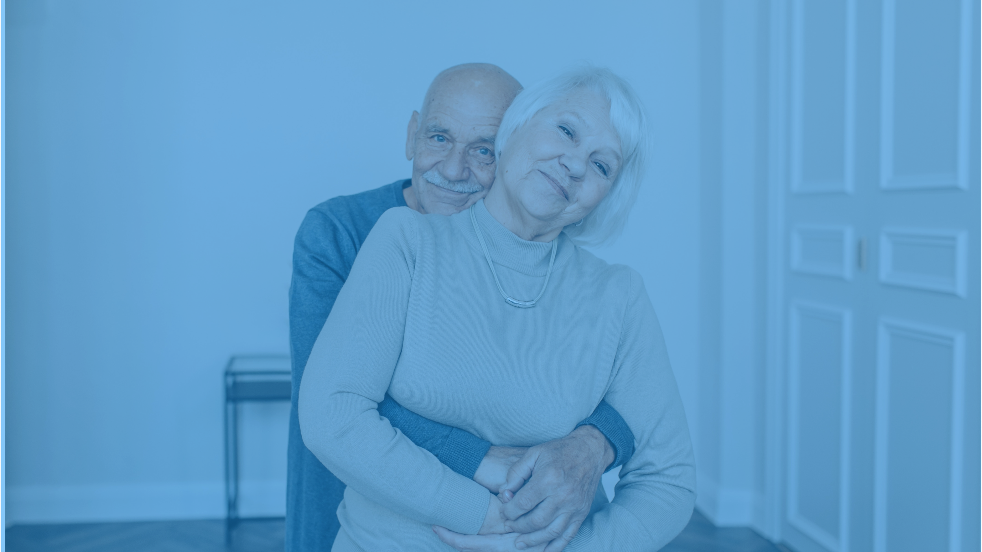 Couple smiling with blue overlay