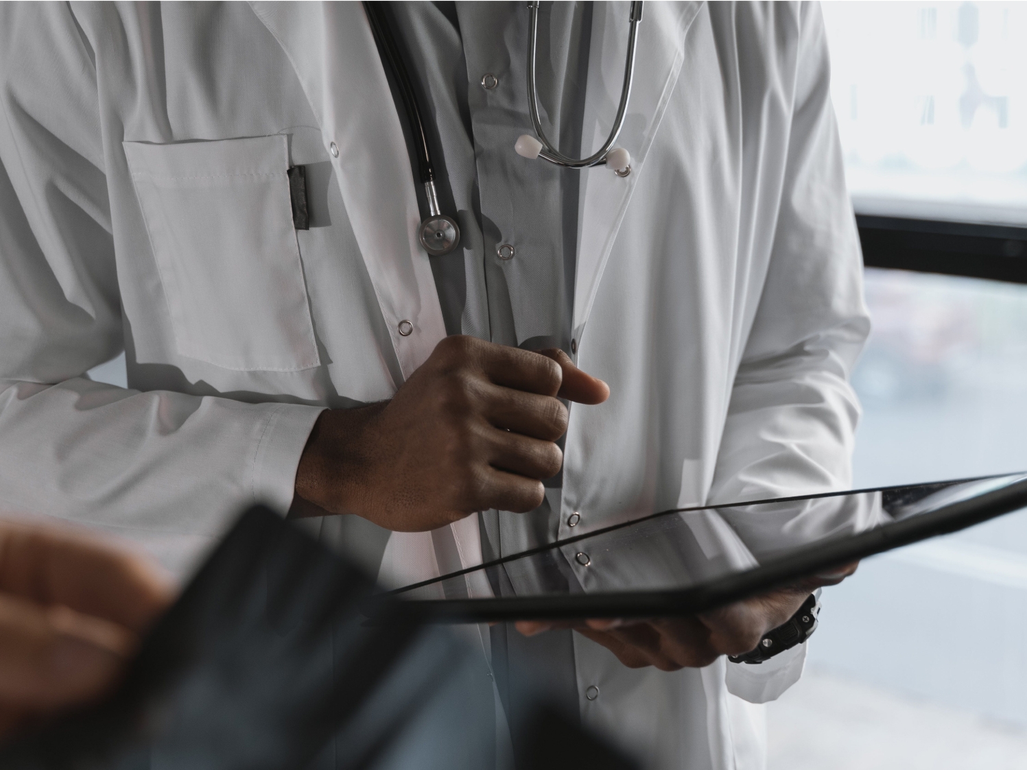 Care team reviewing report on ipad