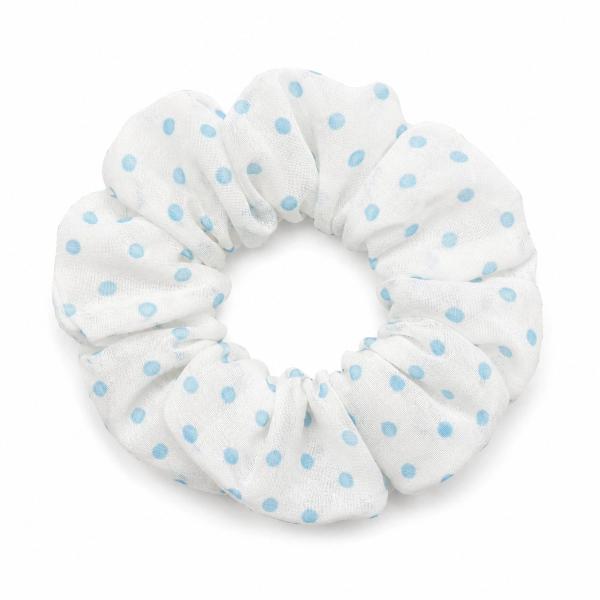 A round white fabric scrunchie with light blue polka dot print, photographed on a white background.