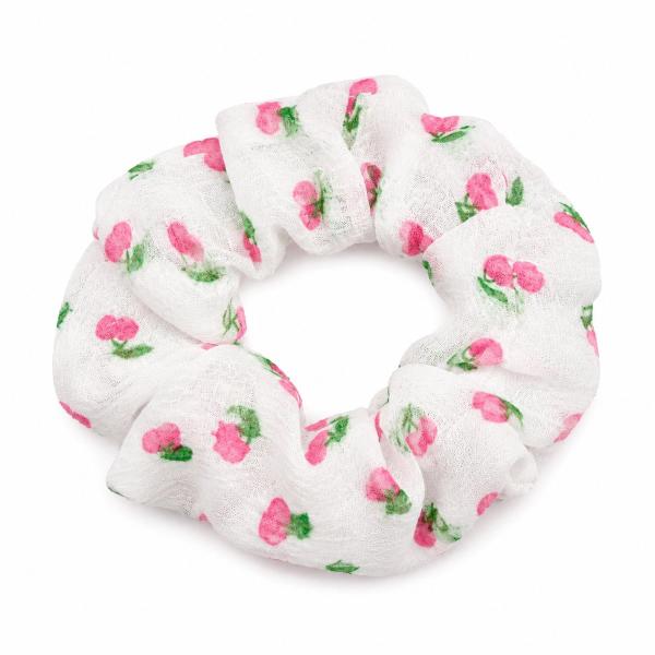A puffy white gauze scrunchie with an all-over pink cherry and green leaf print, photographed on a white background.
