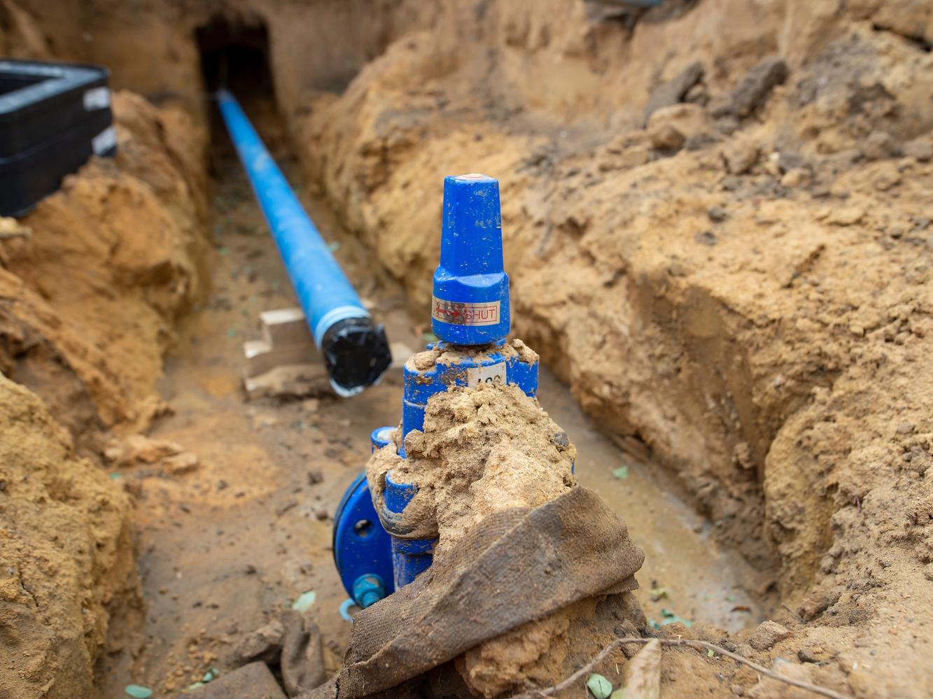 Decorative image of a water supply pipe being installed by Waterlink