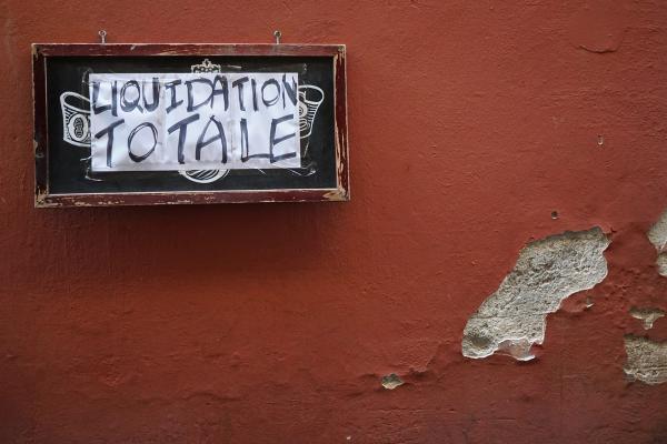 liquidation sign on a wall