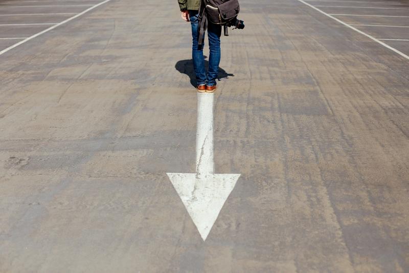 a man standing on an arrow