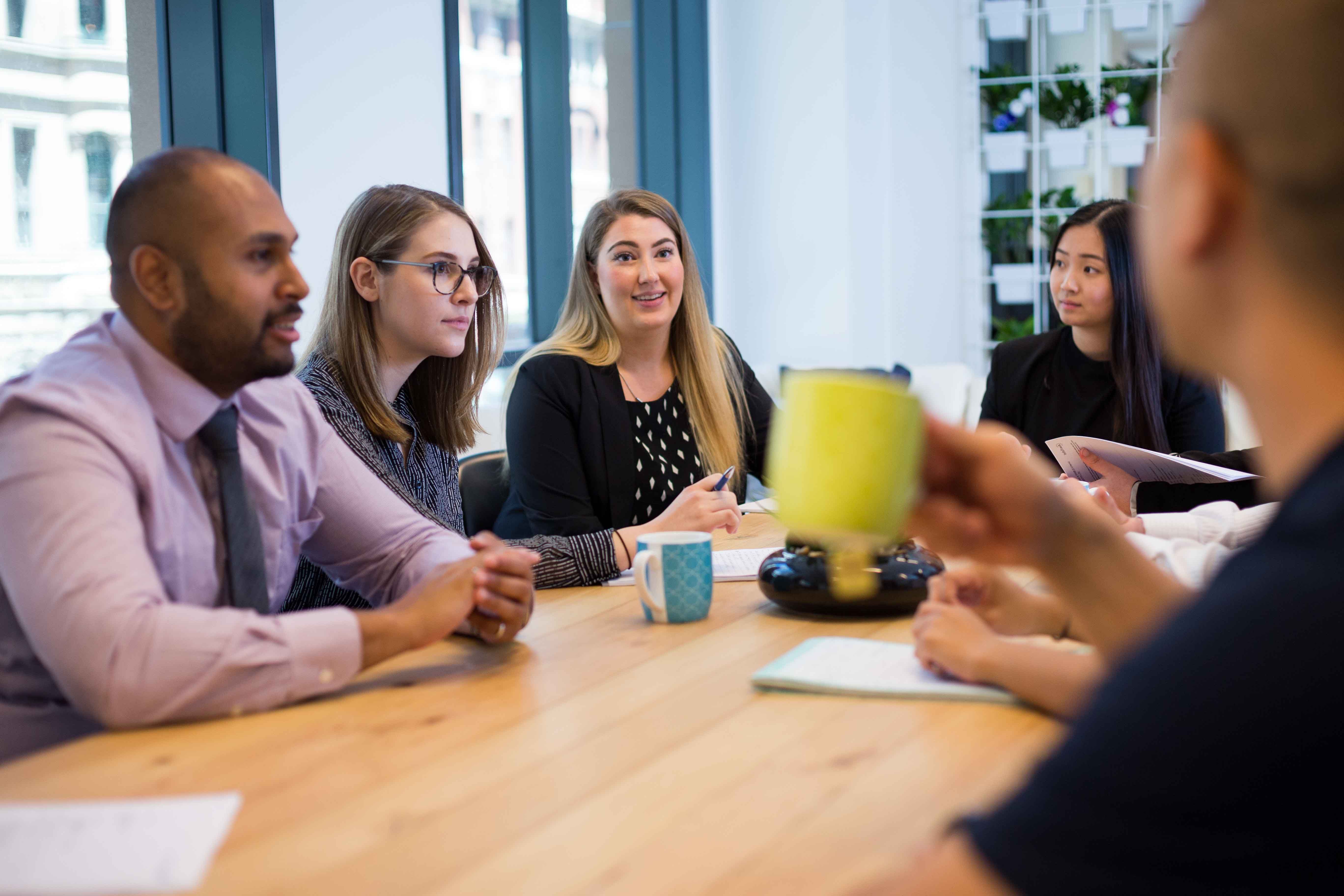 5 people meeting about liquidatio