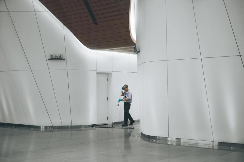 cleaning company cleaning a hallway