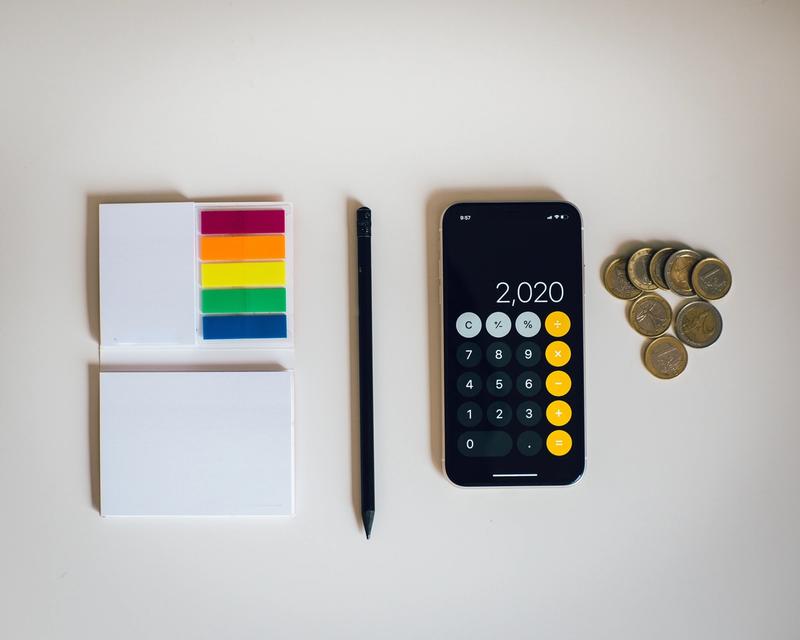 stationary and coins on a desk