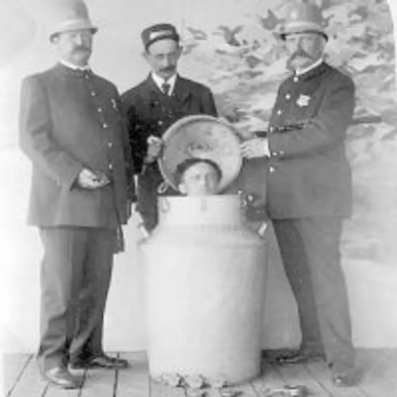 Harry Houdini performs the great milk can escape