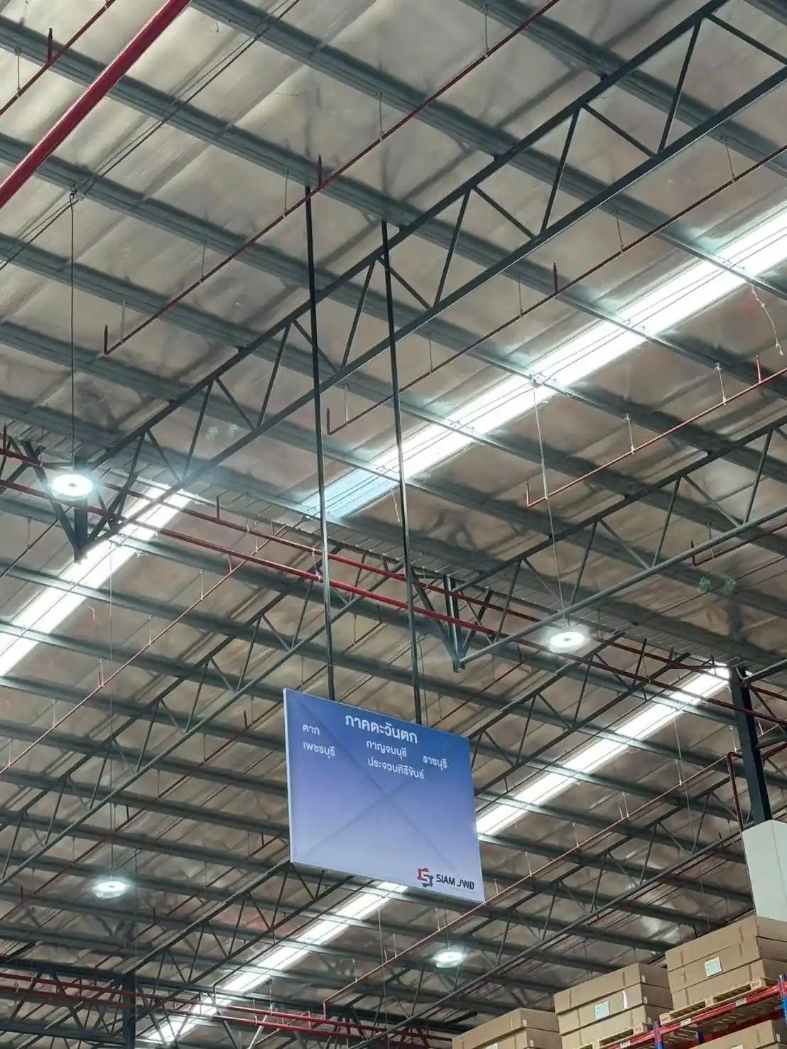 Steel-frame vinyl sign communicating information in a business premises