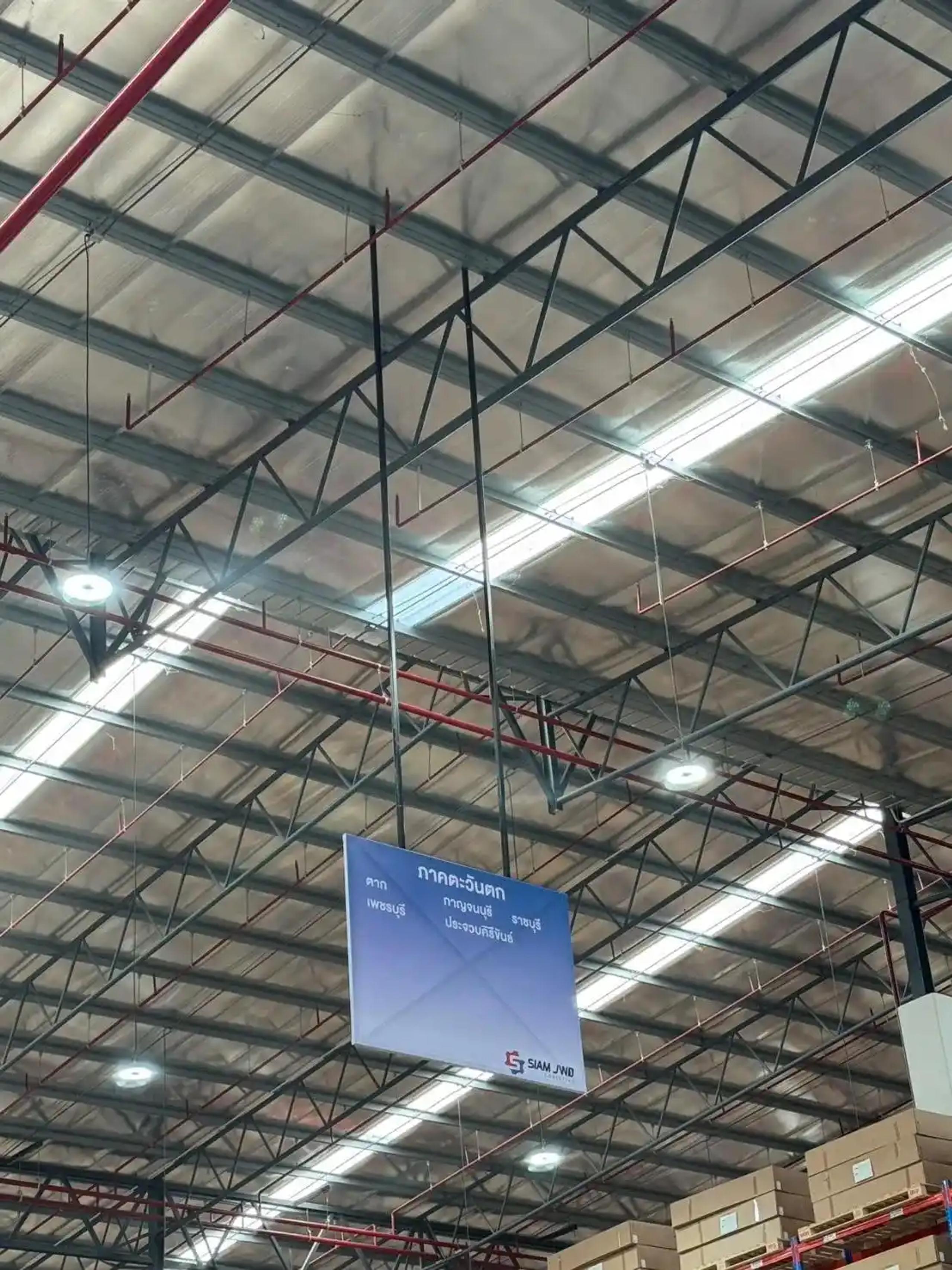 Steel-frame vinyl sign communicating information in a business premises