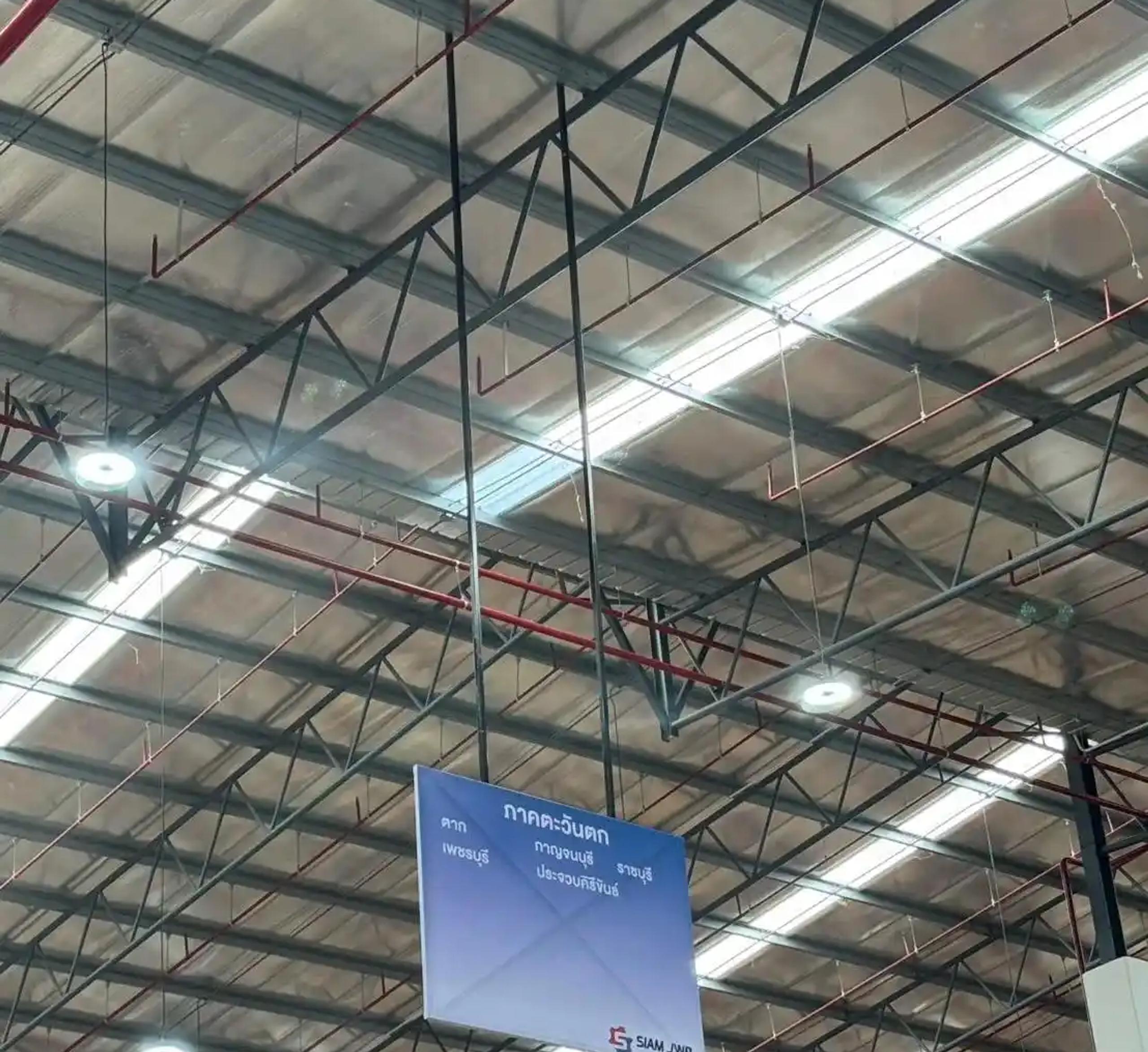 Steel-frame vinyl sign communicating information in a business premises