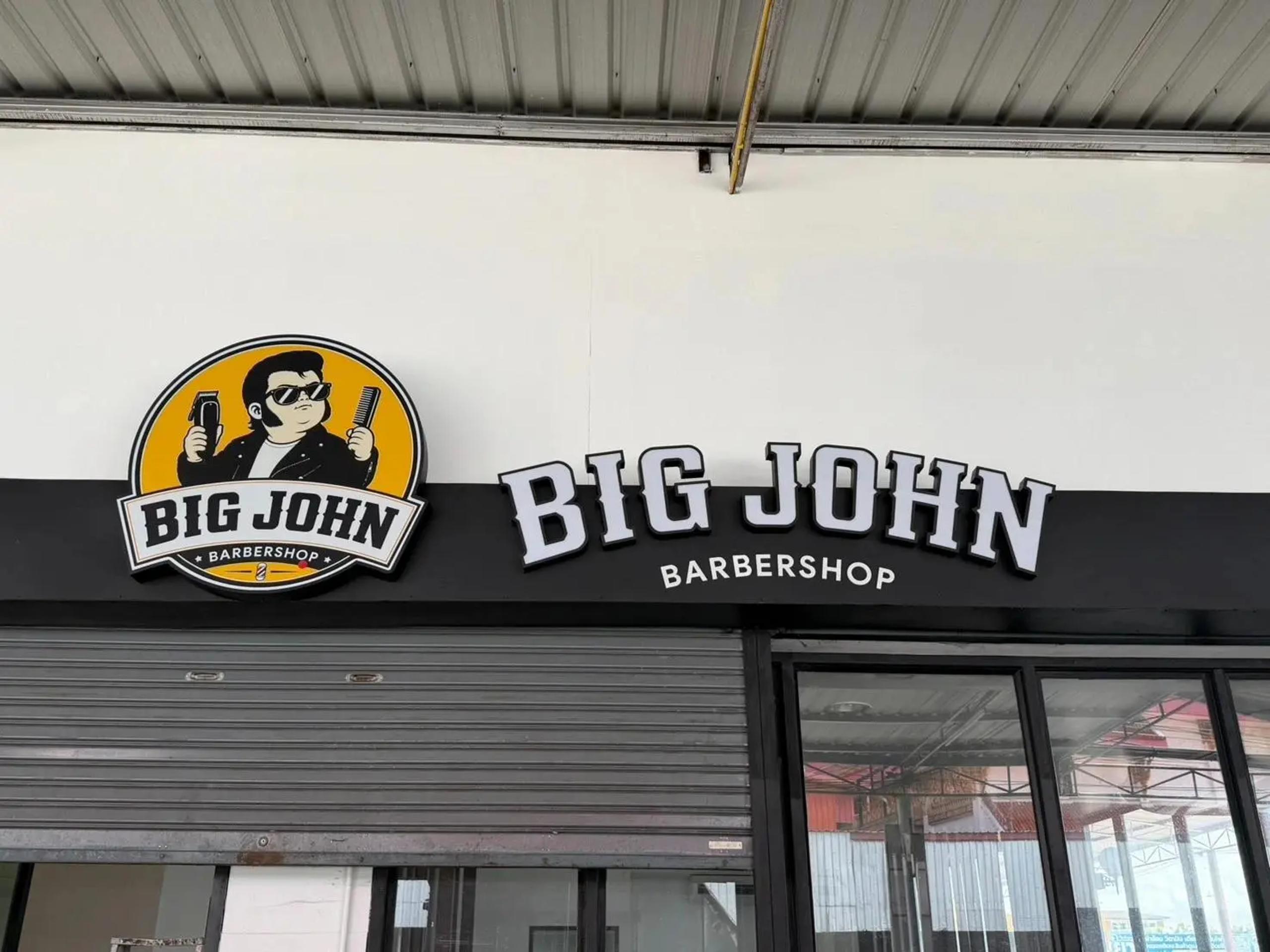 Front-lit raised lettering sign installed at a storefront
