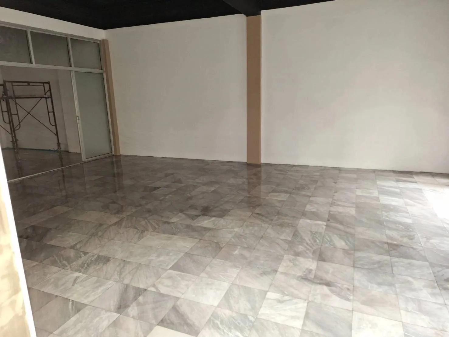 Warehouse office floor tile installation
