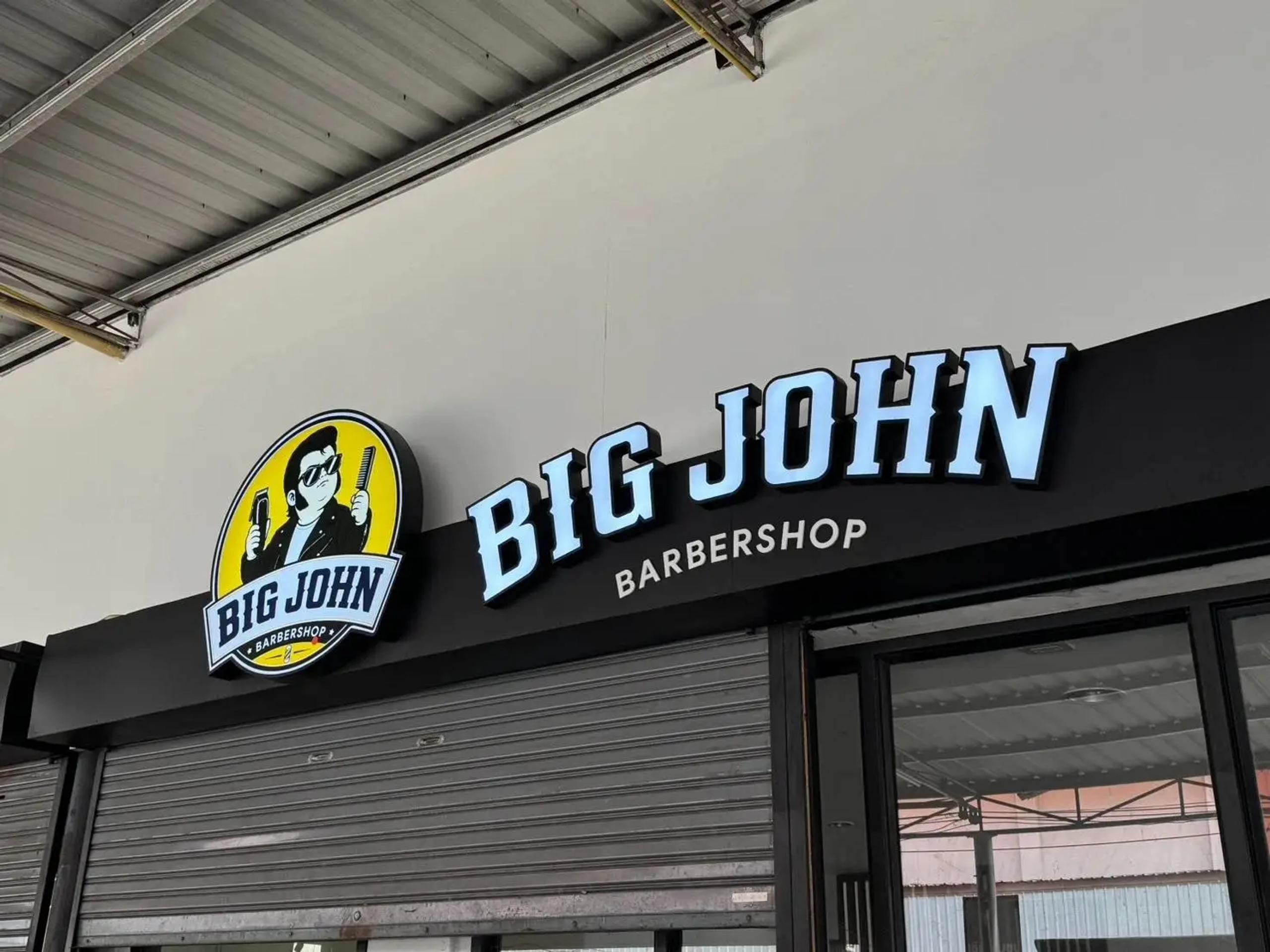 Storefront lettering sign with graphic elements