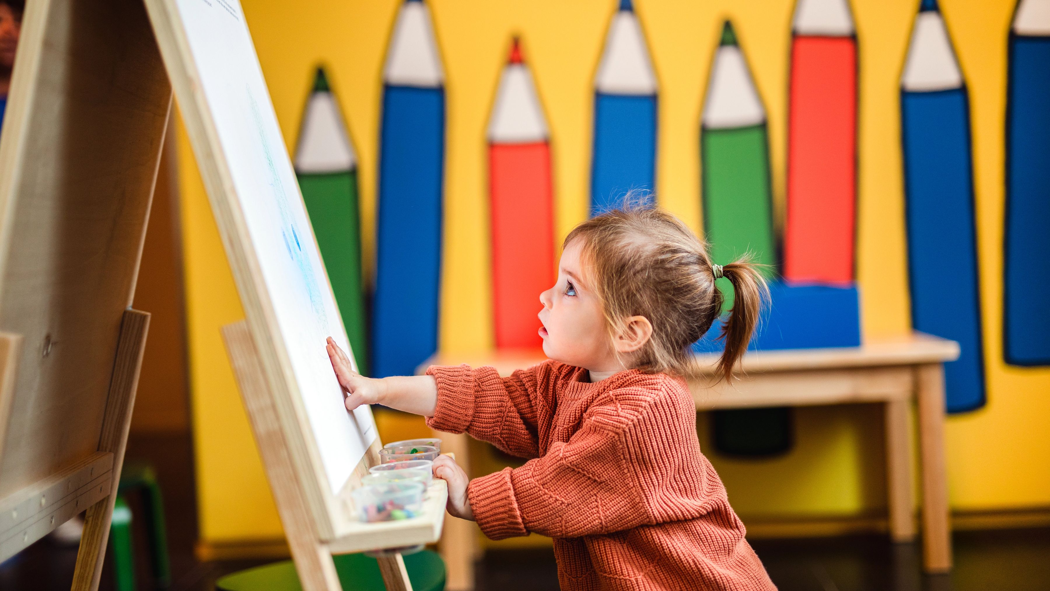 child drawing in art room