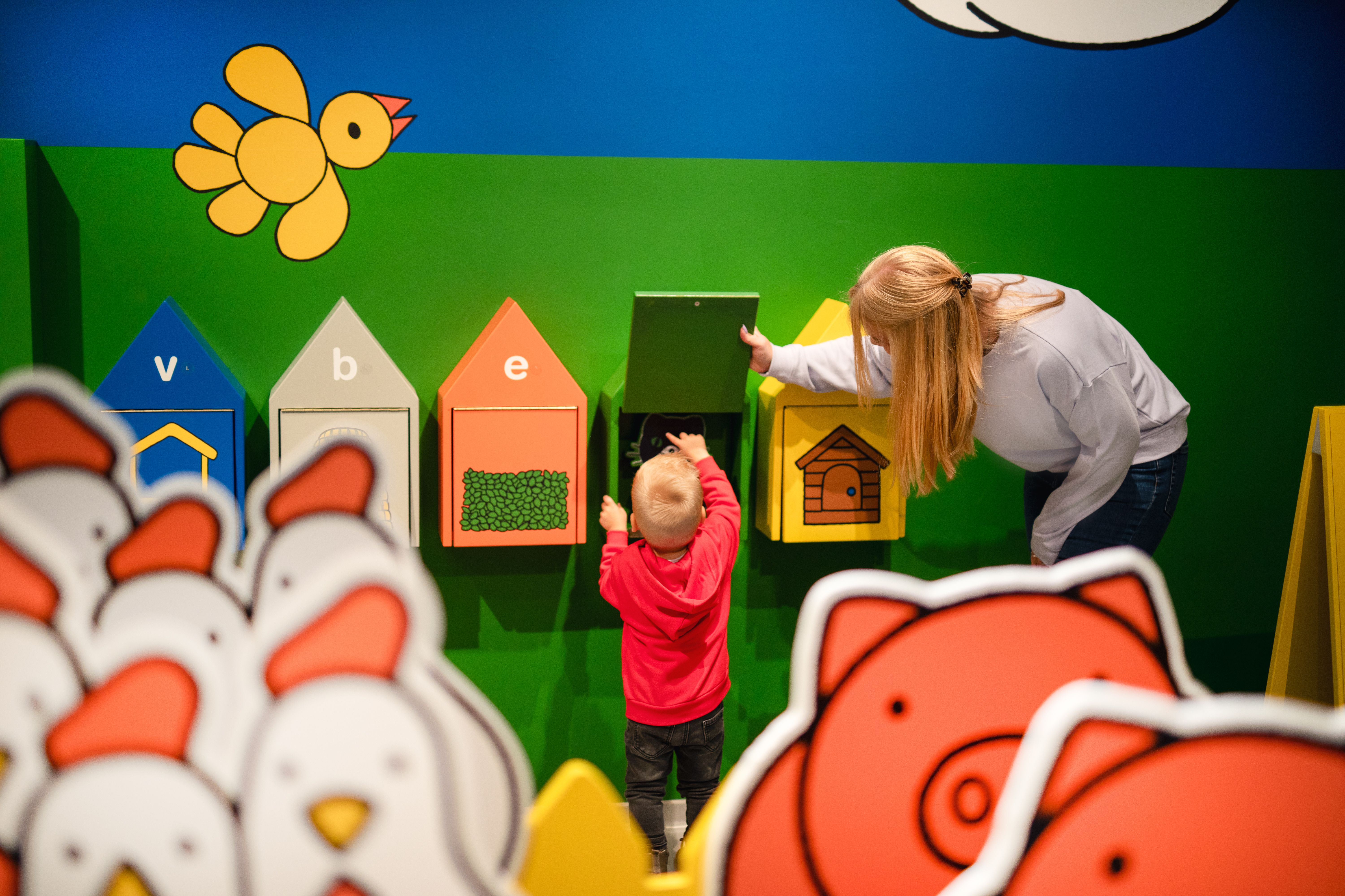 child and adult in the farm area