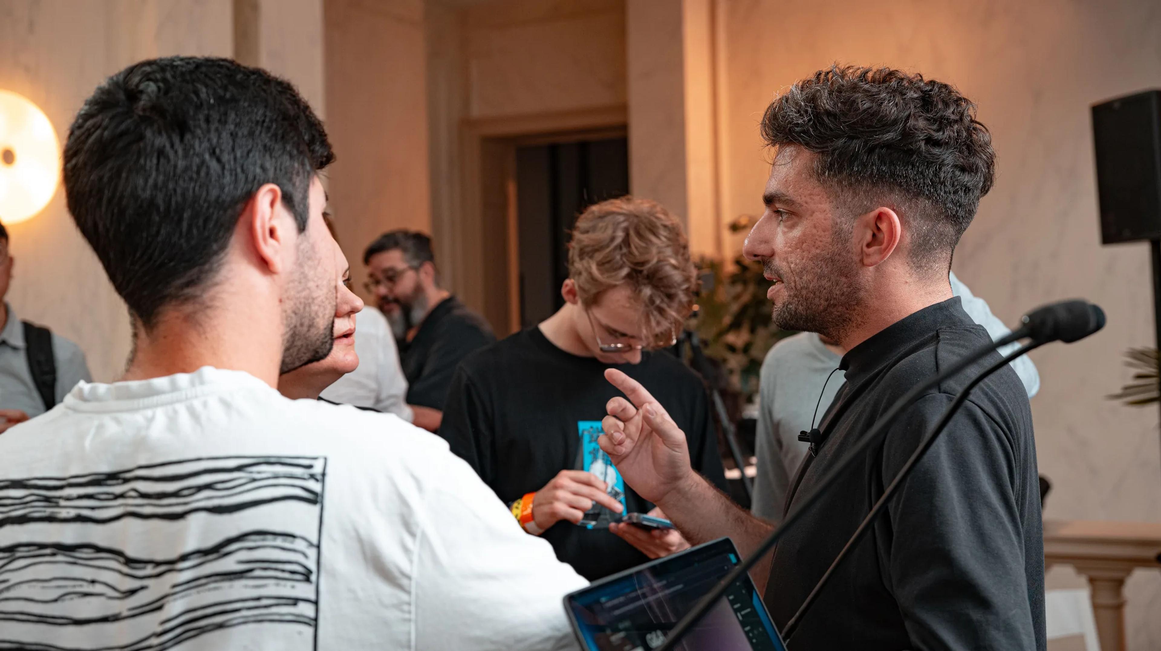 Attendees talking at the Agnostic event