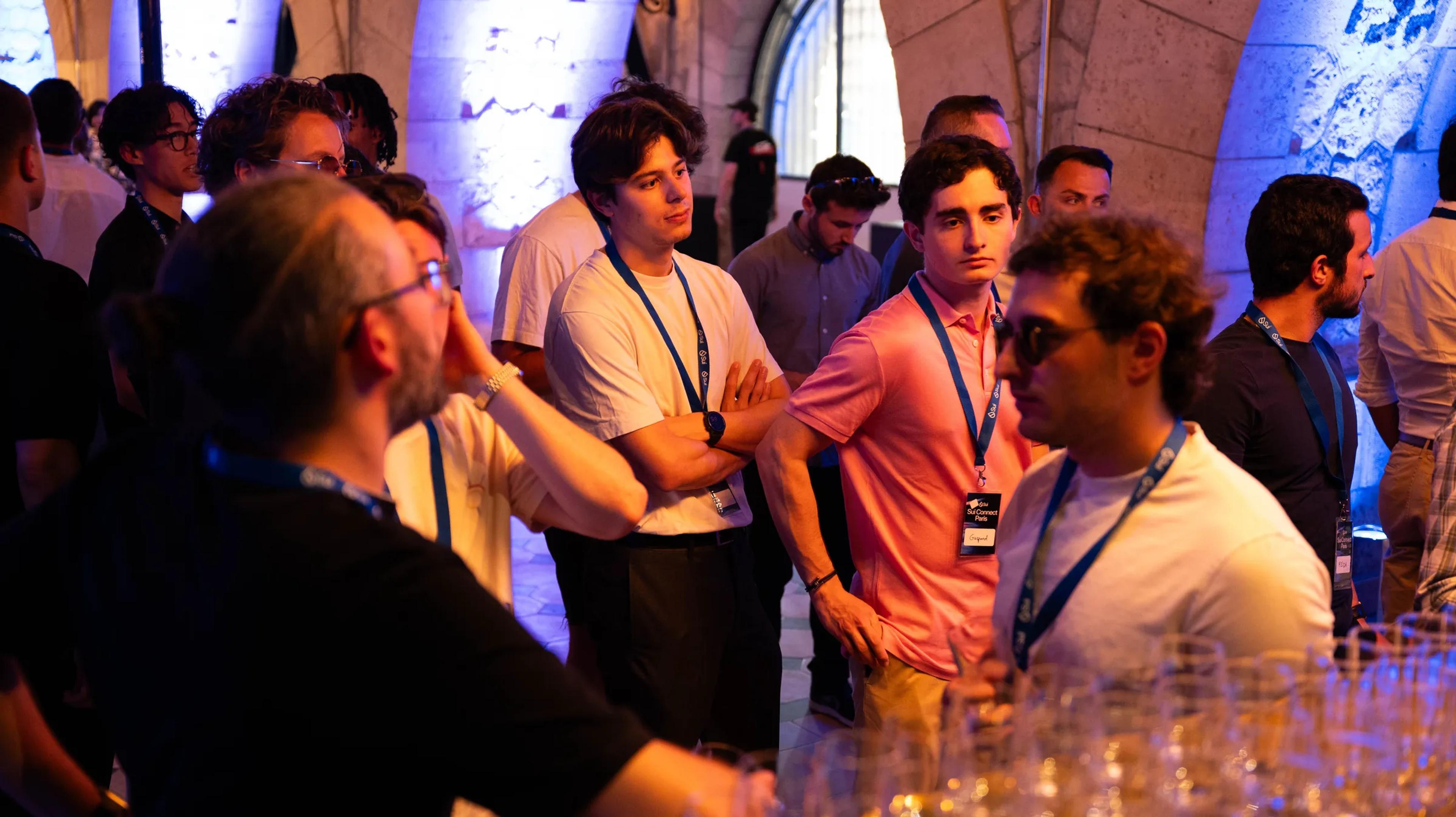 Attendees in conversation at the evening reception