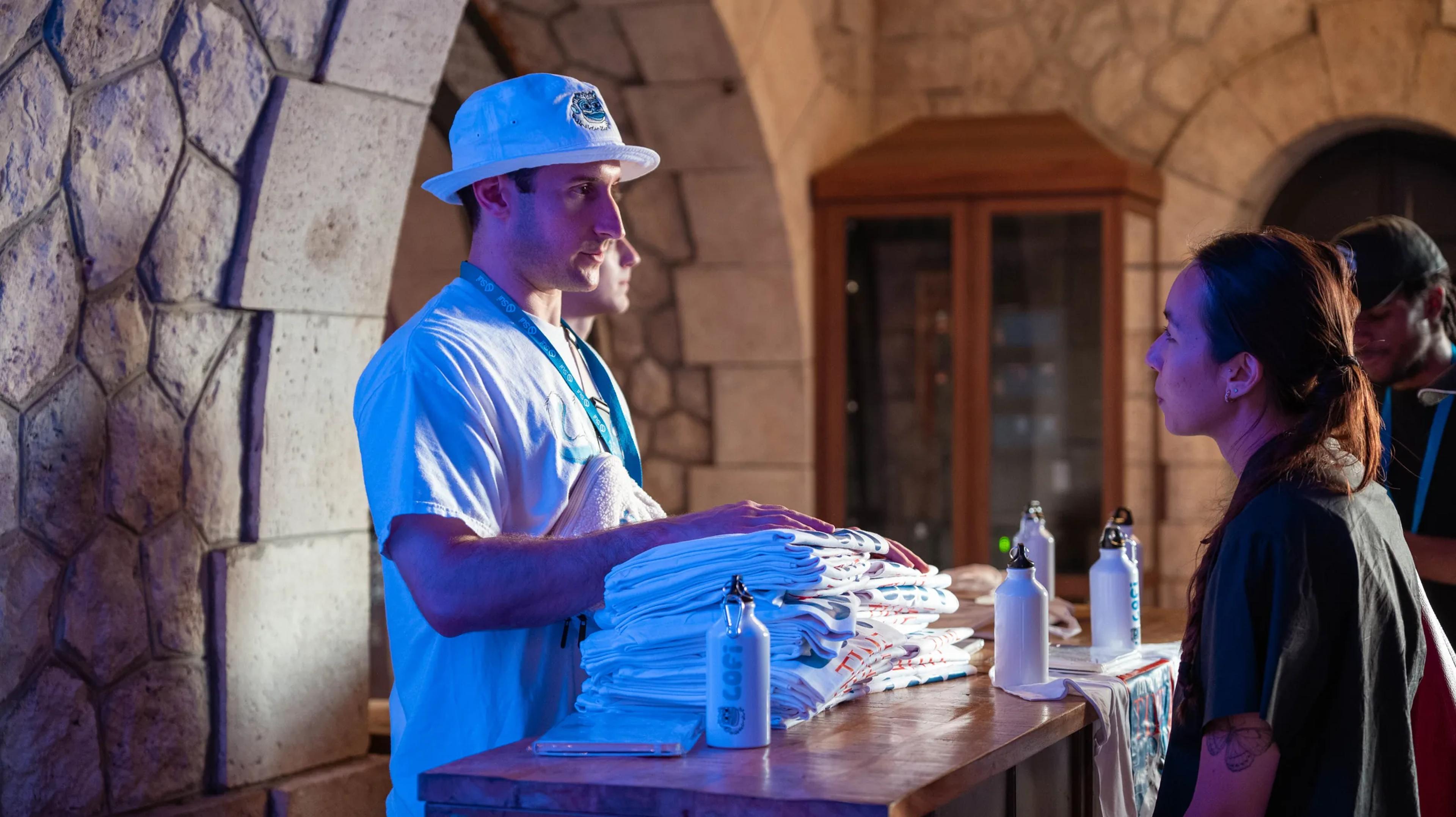 A host serving drinks at the venue bar