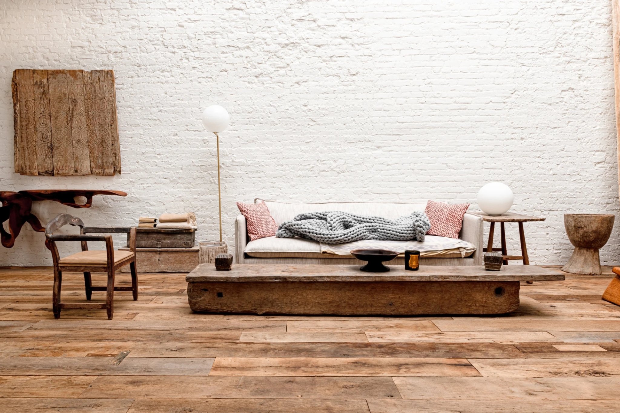 High above the streets of Manhattan, at the summit of a 125-year-old building in Soho, a penthouse merges old-world materiality with uncompromising modern vision. Designed by Andrianna Shamaris in collaboration with architect Thomas Leeser, this is a space where every surface has been curated, every detail purpose-chosen.
Shamaris is at the very forefront of modern organic furniture, serving leading architects, designers, stylists, and influential figures worldwide. Her pieces are available on her website and through 1stdibs . Speaking with 1stdibs, Shamaris describes the project, situated in her own penthouse apartment and her most personal to date, as “about imperfection.” Her vision called for texture over color, and form over ornament.
This ethos is felt most powerfully underfoot. The floors - wide 17th-century French oak boards - were carefully reclaimed, restored, and finished by our artisans. Each board was selected to retain its raw character: weathered grain, natural variation, the visible imprint of centuries past.