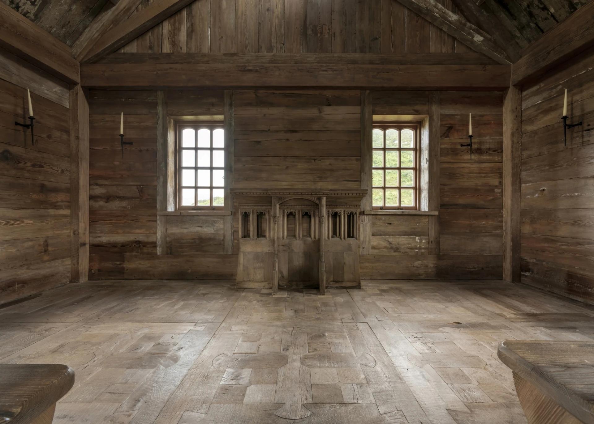 Woodworks’ expertise found its fullest expression in the floor. Inspired by a Pugin altar piece in the island’s central meeting house, the design was handmade in the Woodworks Cheshire workshops. Antique oak was carefully restored and assembled into interlocking sections, secured with over 3,000 wooden pegs. No modern finishes were applied, only the original patina of the reclaimed wood was revealed.